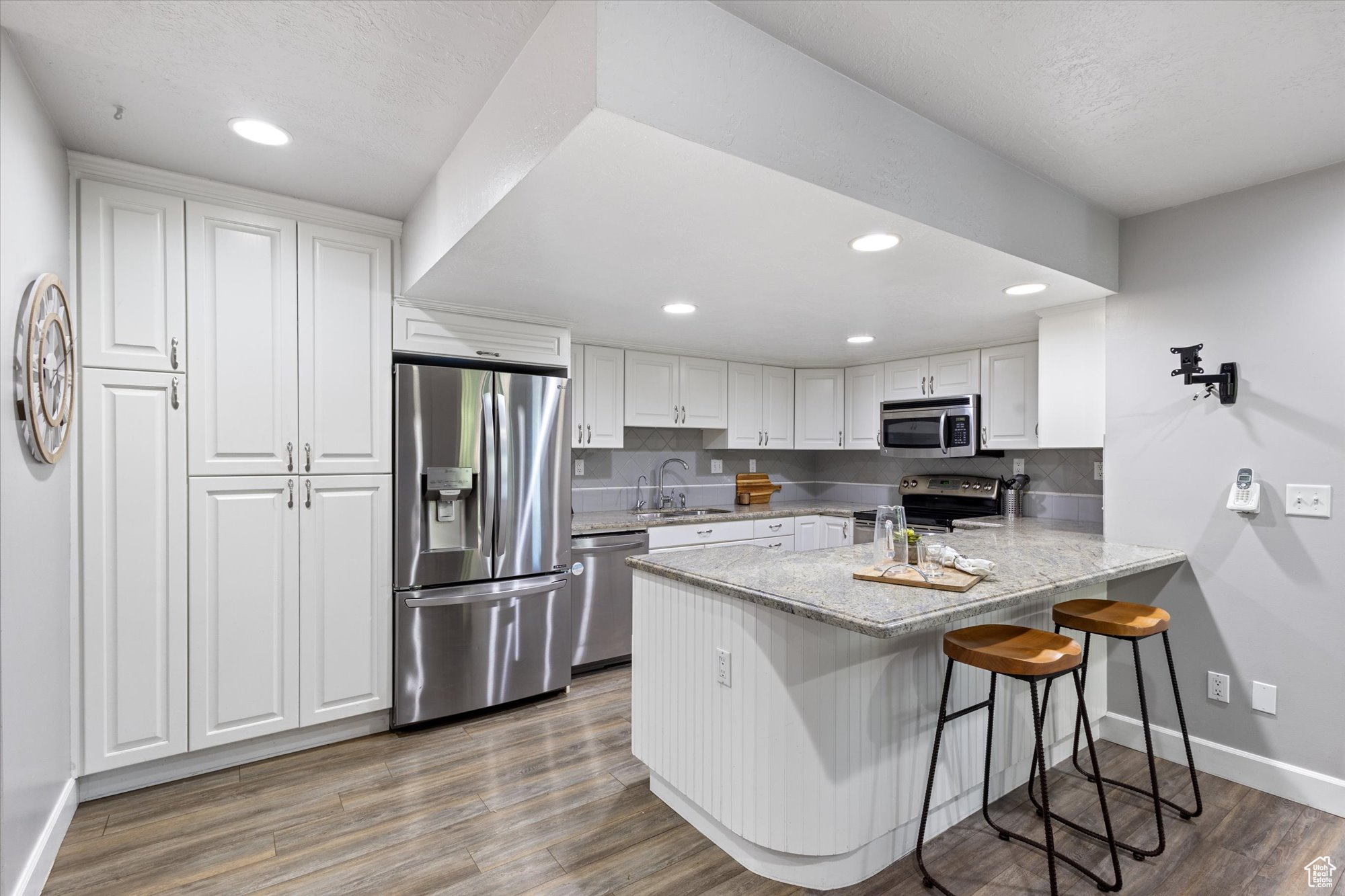 Custom kitchen, granite countertops, under cabinet lighting and stainless steel appliances.