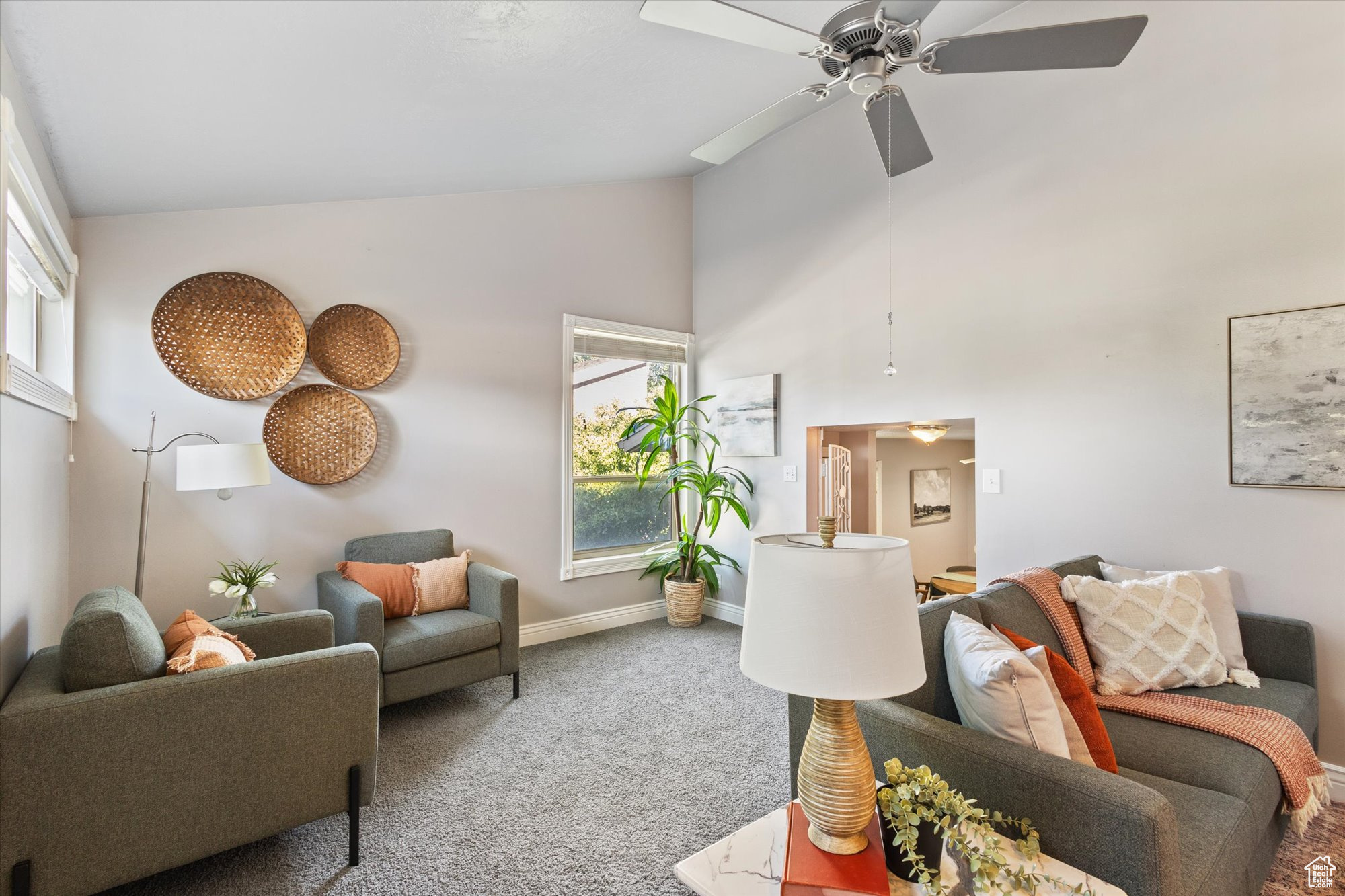 Formal living room with vaulted ceilings and natrural light