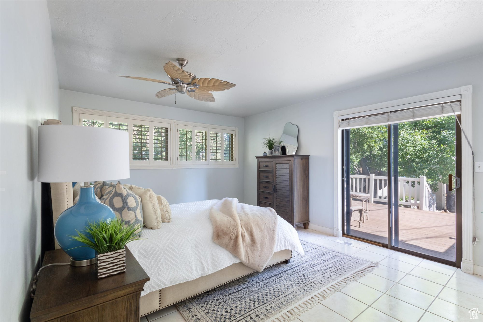 Primary bedroom suite with slide door to the back patio