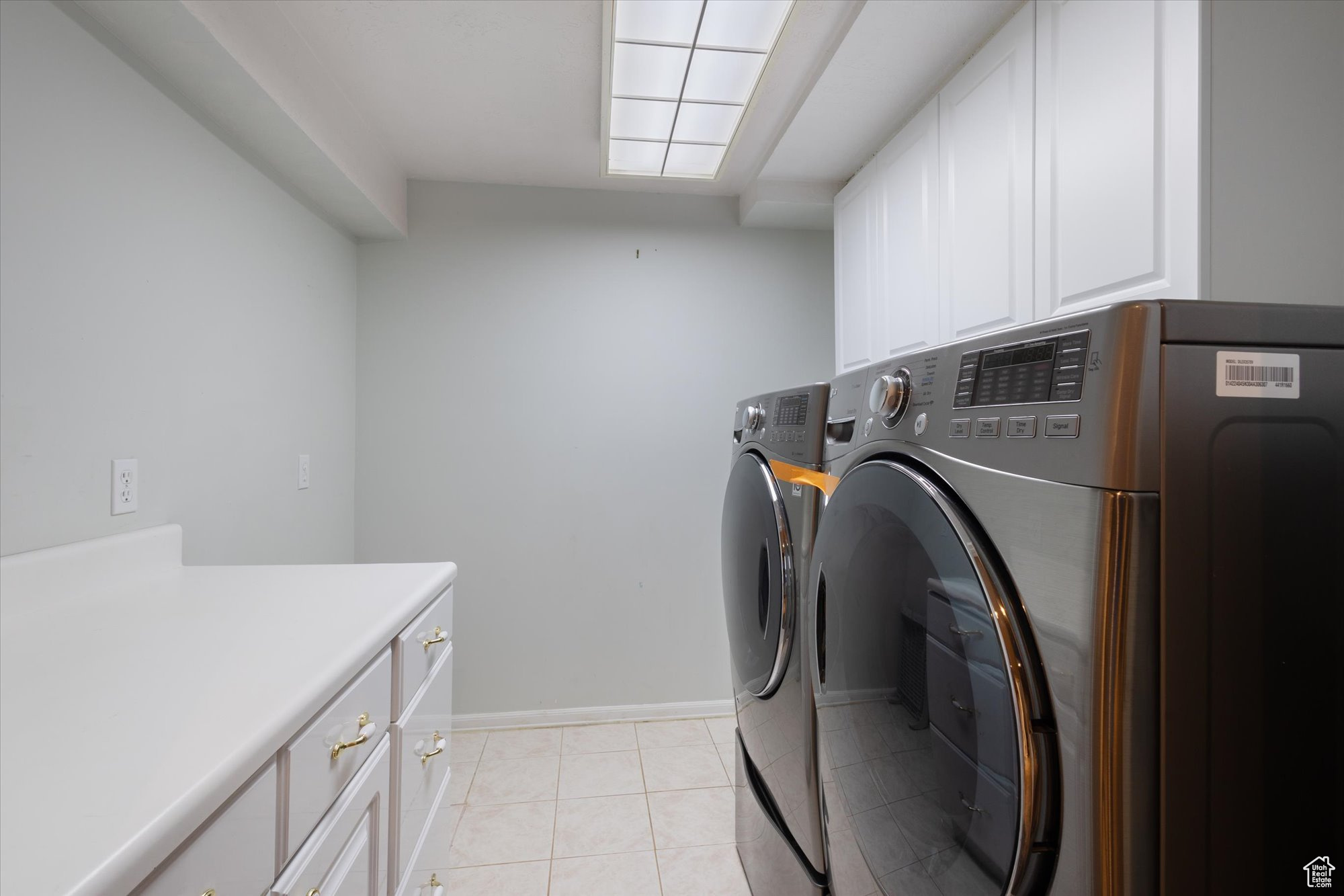 Laundry room with extra storage cabinets