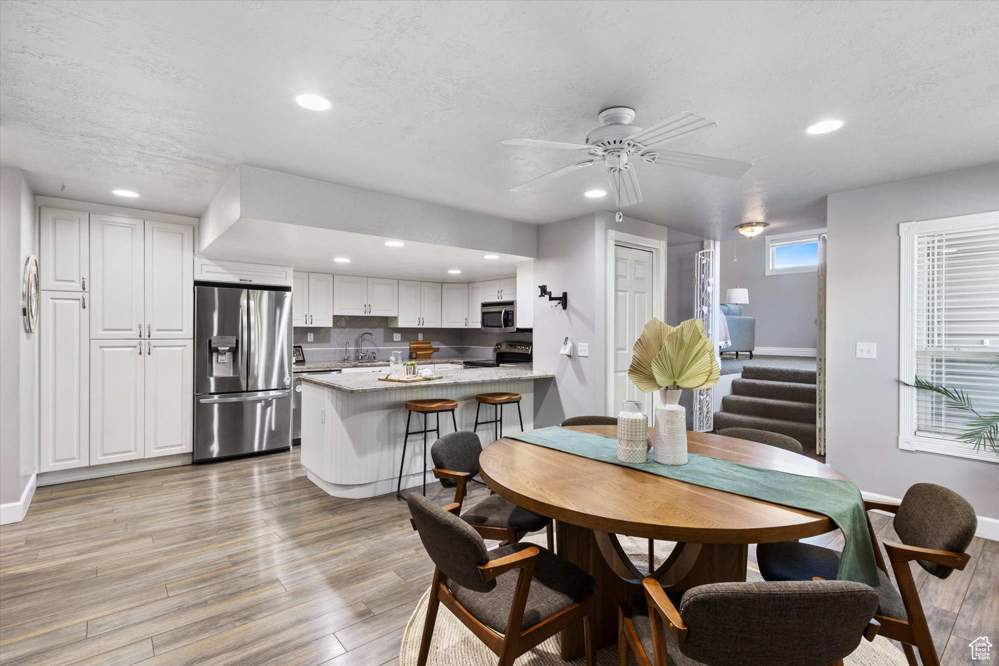 Large semi - formal dining area with peninsula