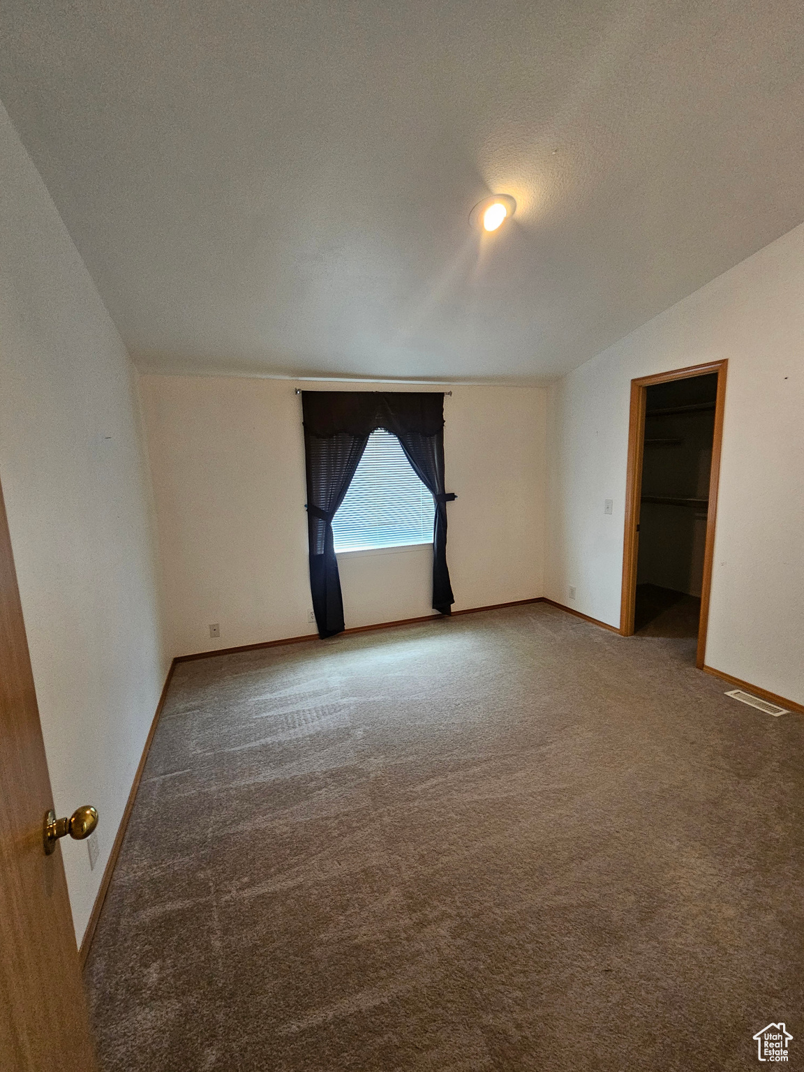 Unfurnished room with carpet floors