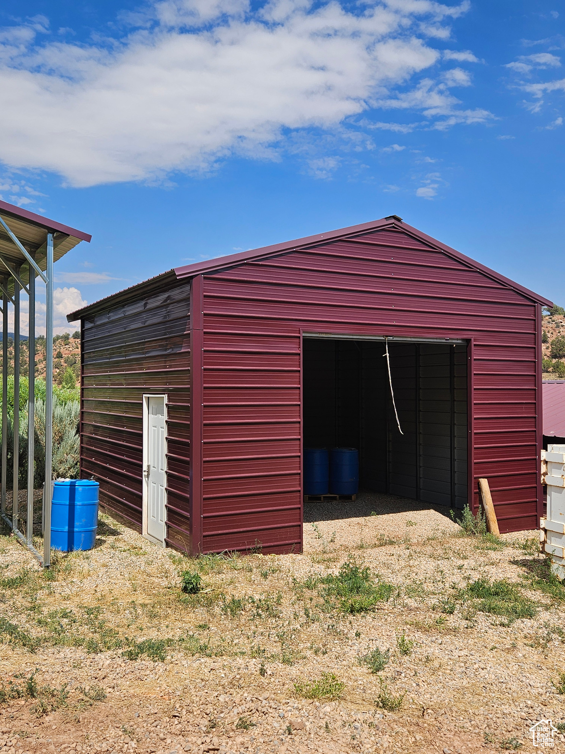 View of outdoor structure featuring a garage