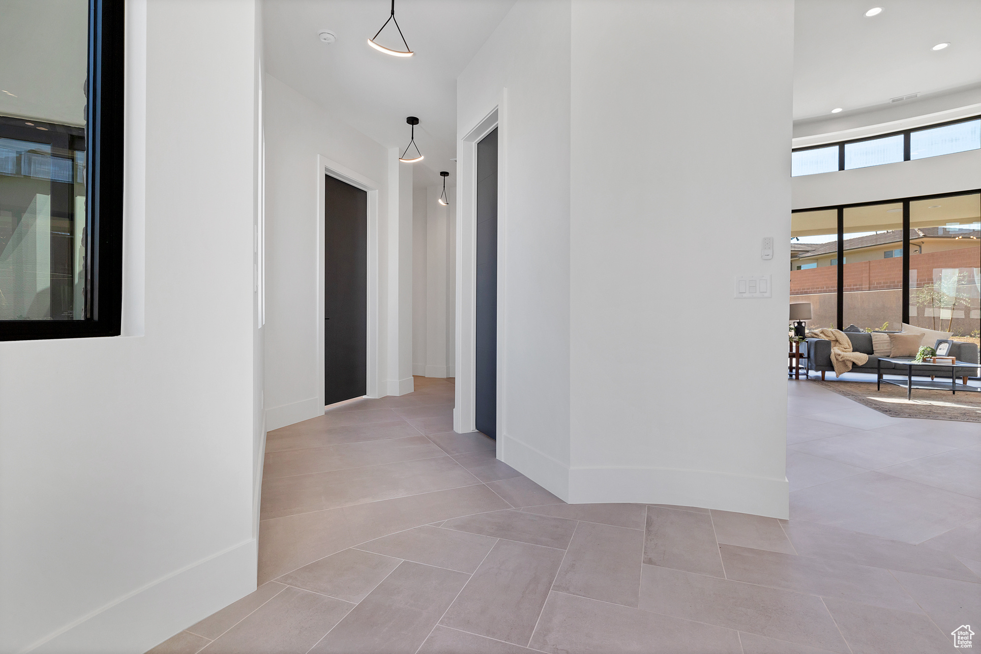 Hallway with tile patterned flooring