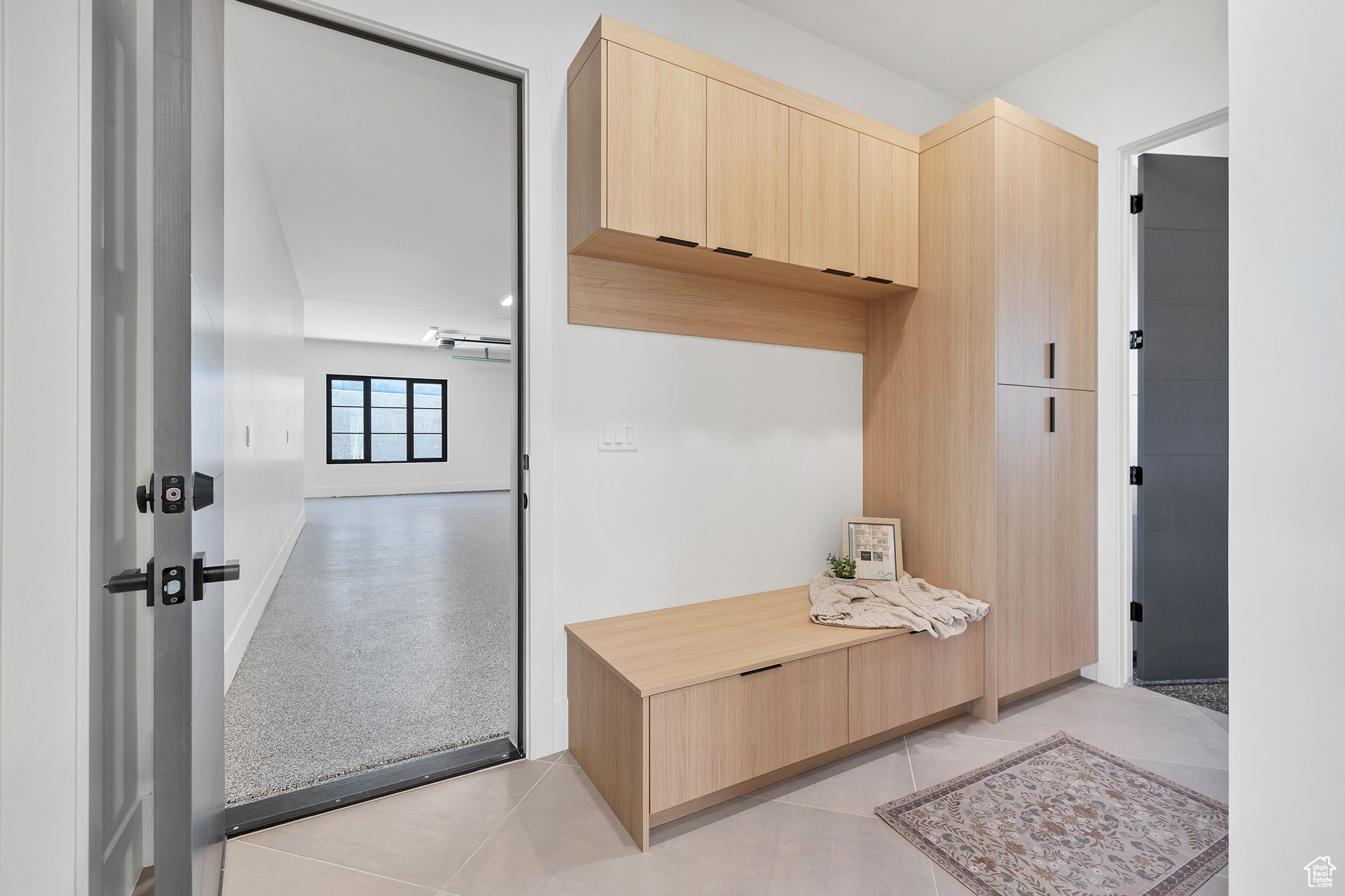 Interior space featuring light tile patterned flooring