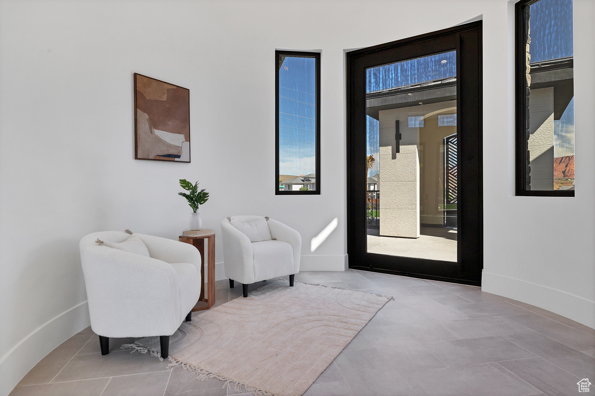 Living area featuring light tile patterned floors