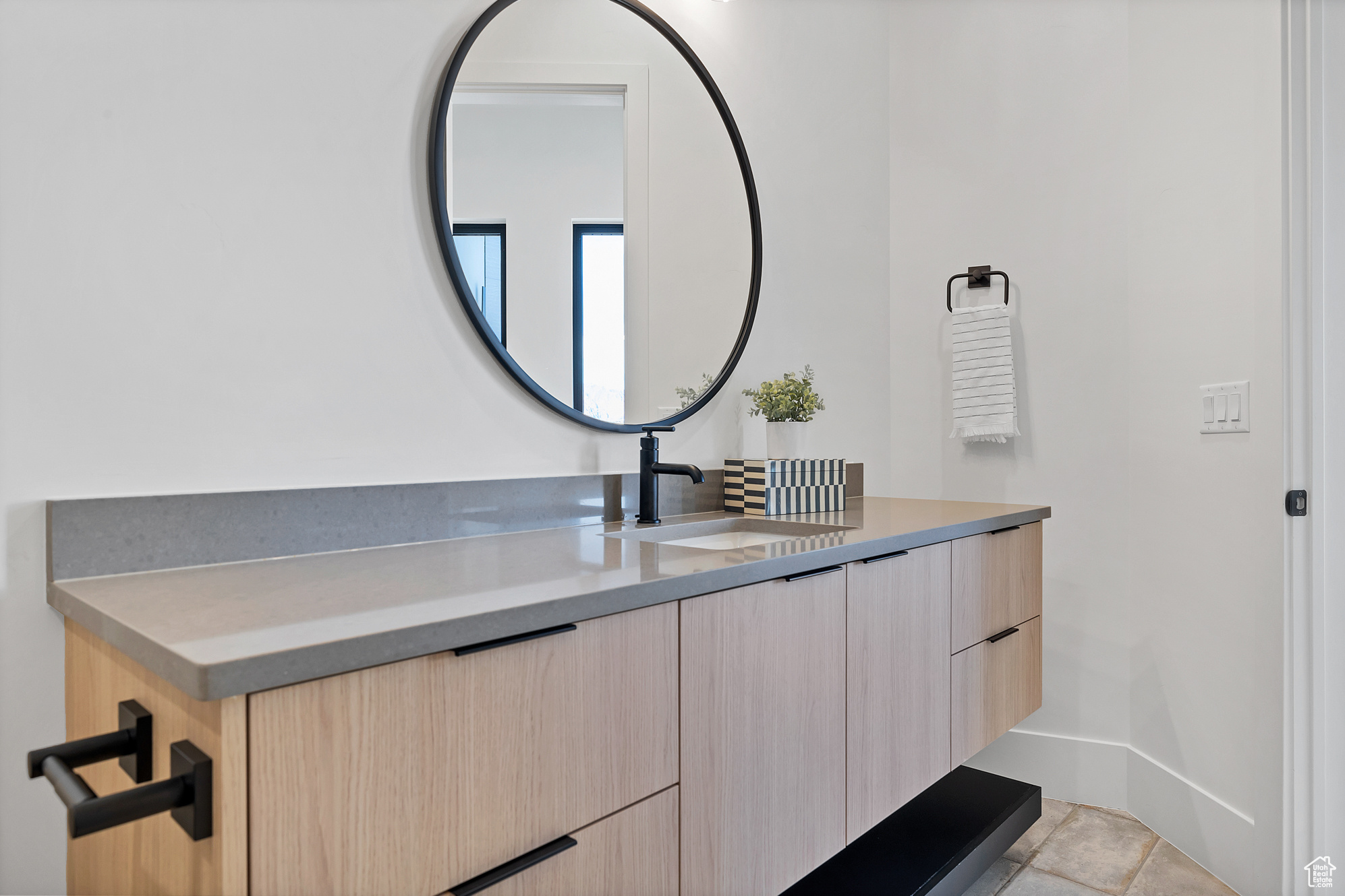 Bathroom with tile patterned flooring and vanity