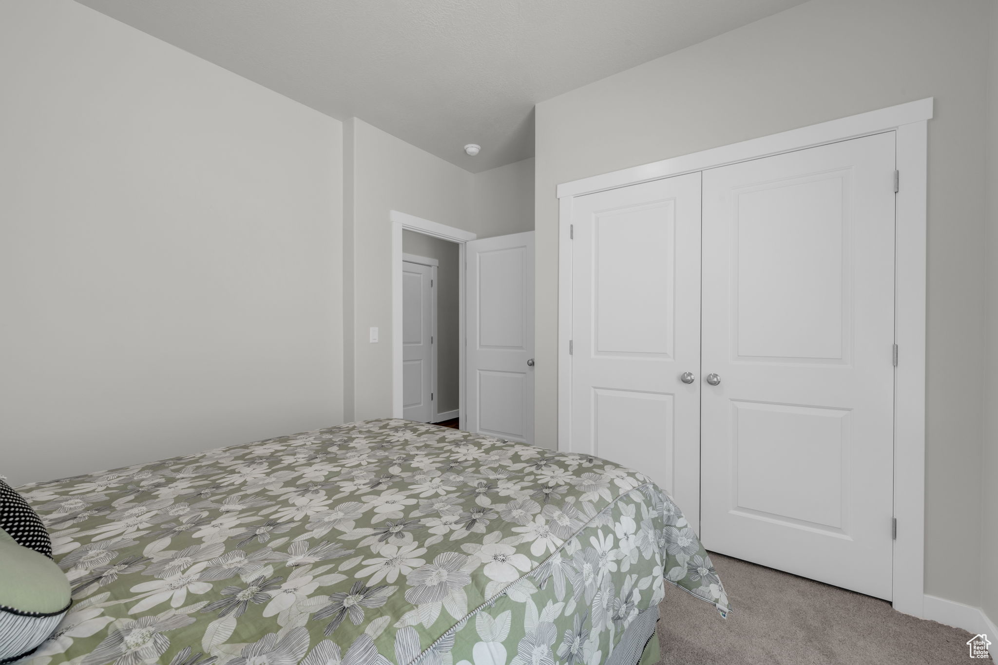 Bedroom featuring a closet and carpet