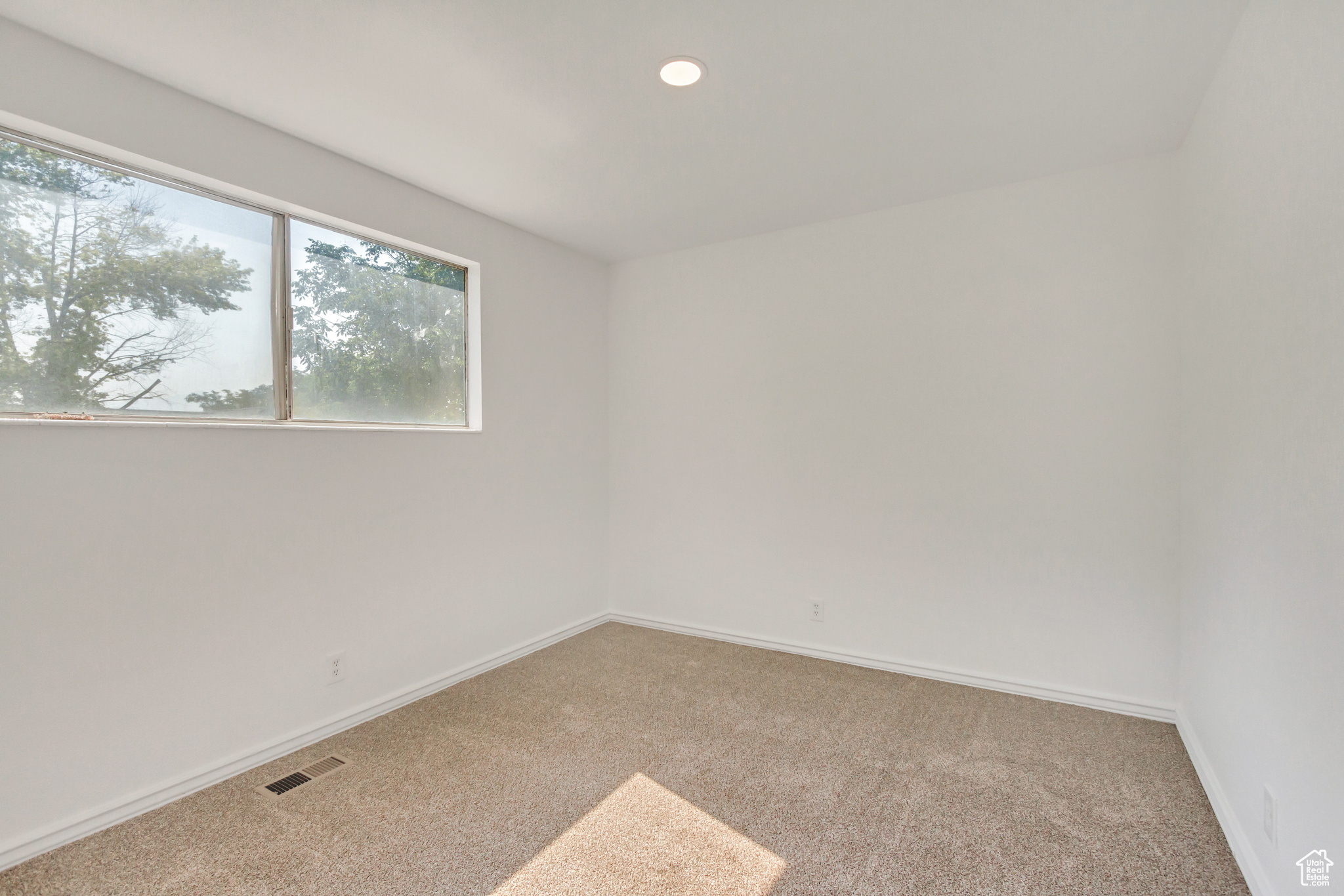 Upstairs bedroom featuring carpet