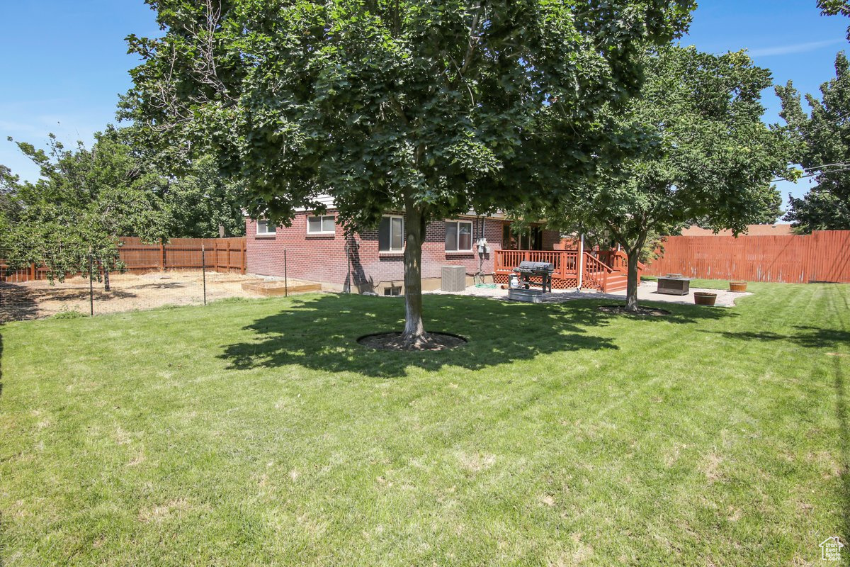 View of yard featuring a wooden deck