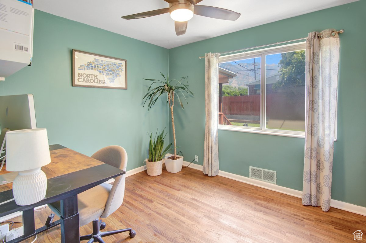 Office featuring light wood-type flooring and ceiling fan