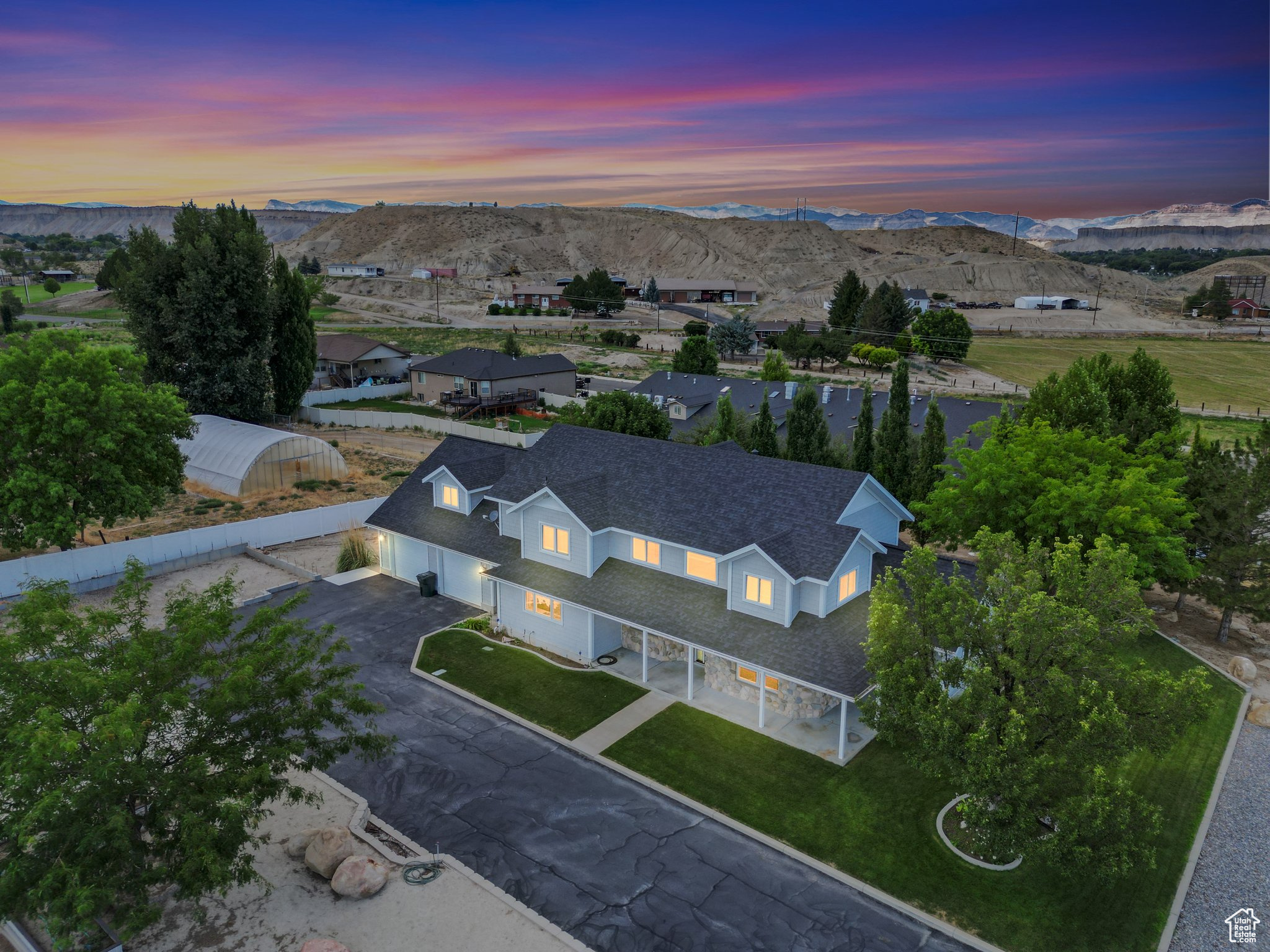 Aerial view at dusk featuring a mountain view