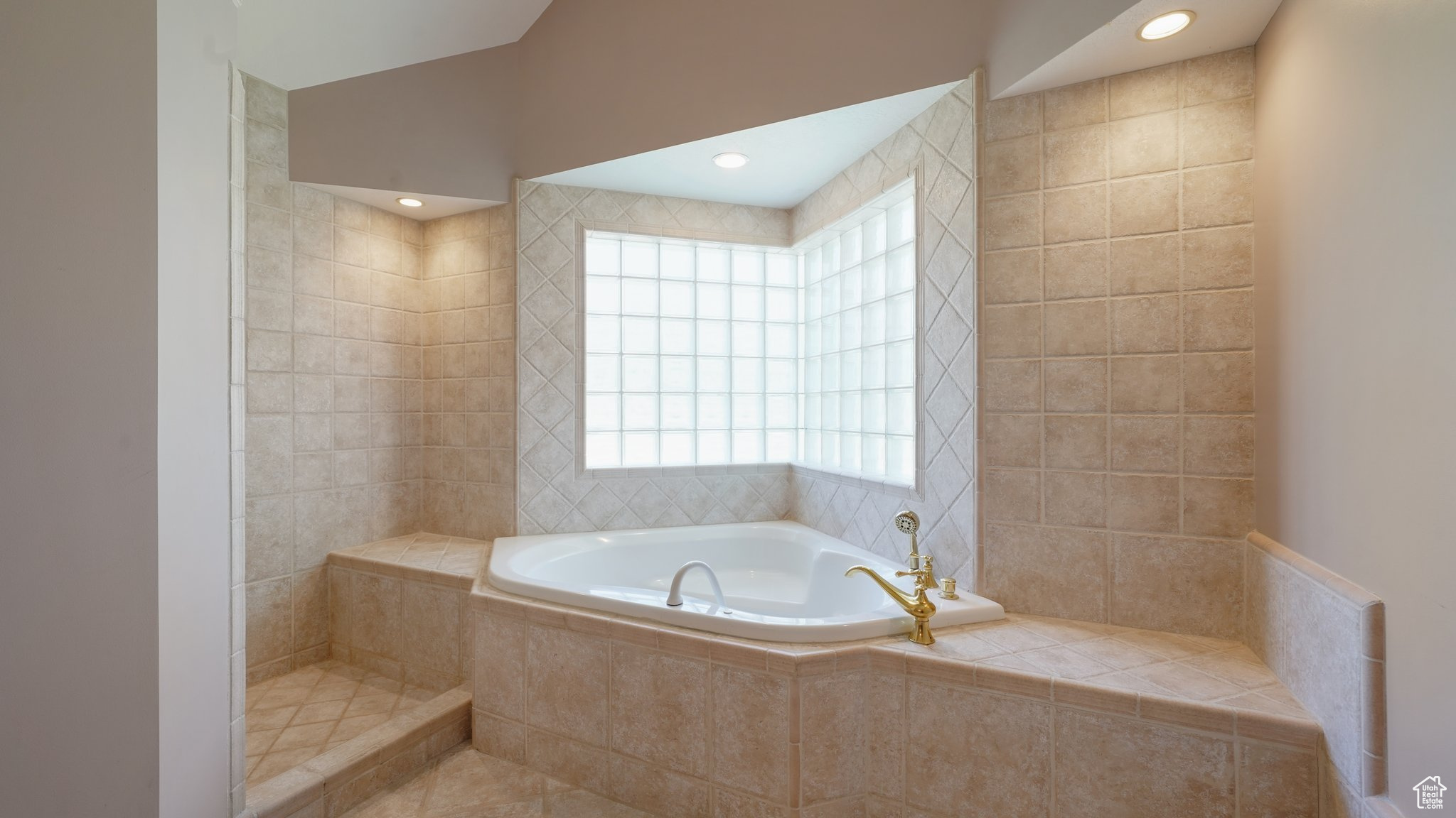 Bathroom featuring independent shower and bath and tile patterned flooring