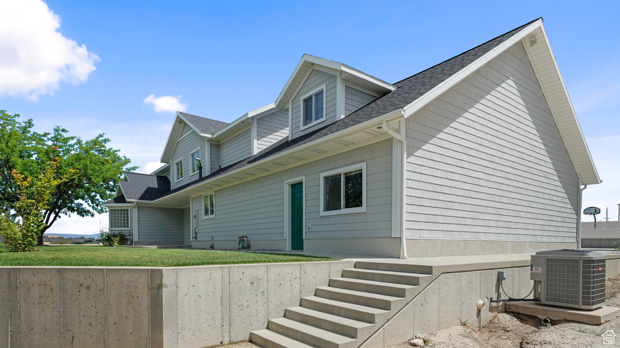 View of property exterior featuring central AC unit