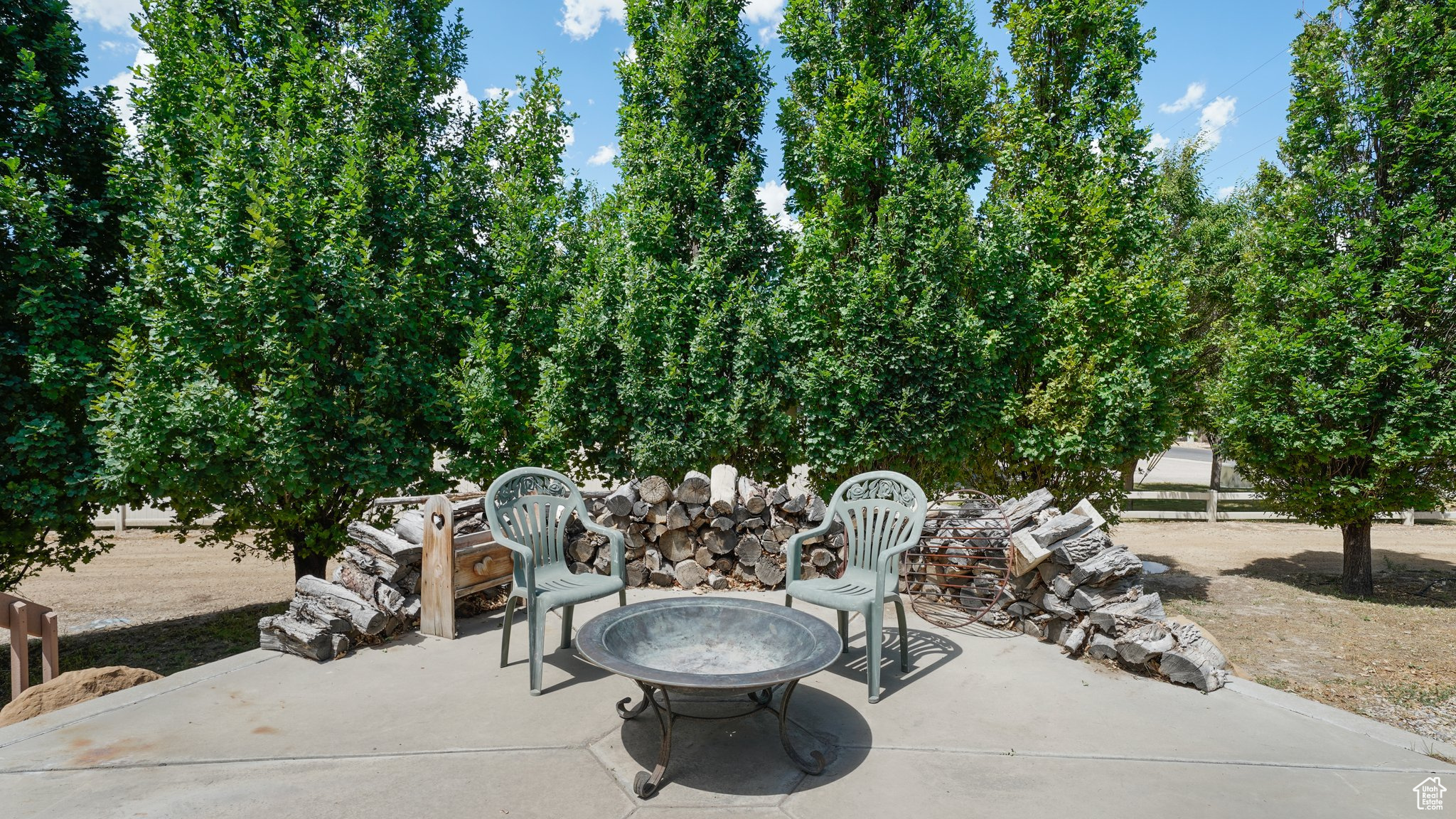 View of patio featuring a fire pit