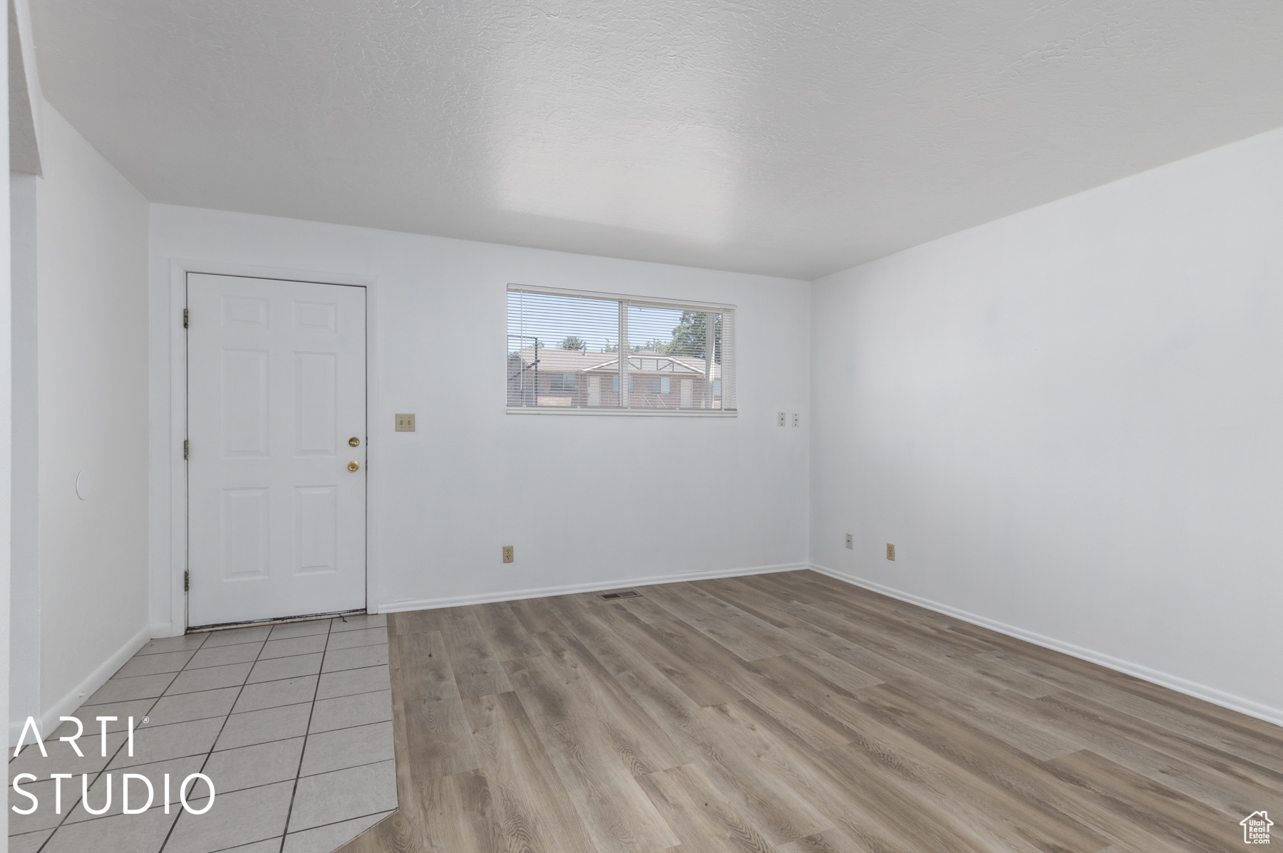 Spare room with light hardwood / wood-style floors