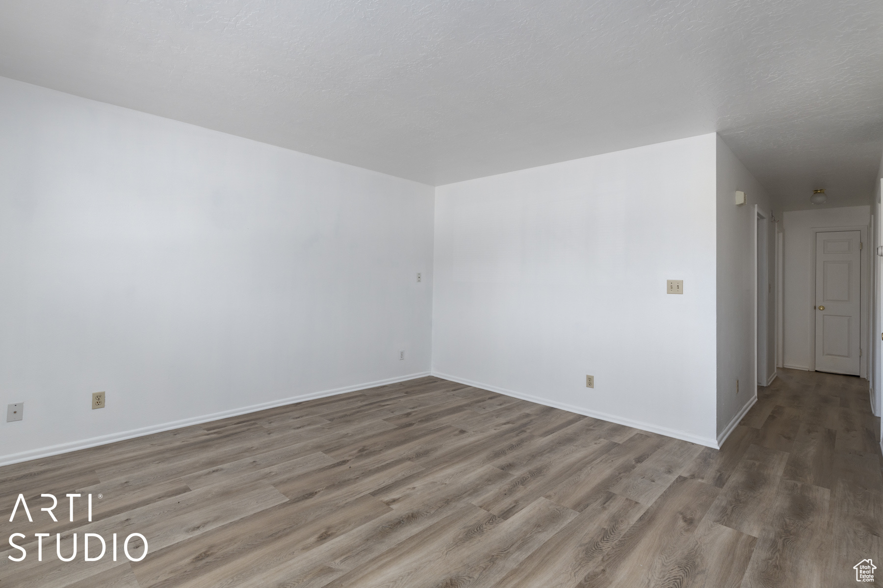 Spare room with hardwood / wood-style floors