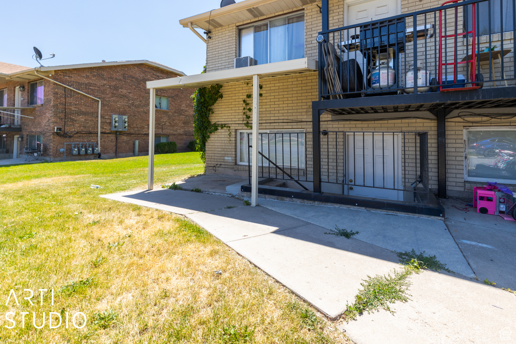 Rear view of property with a yard