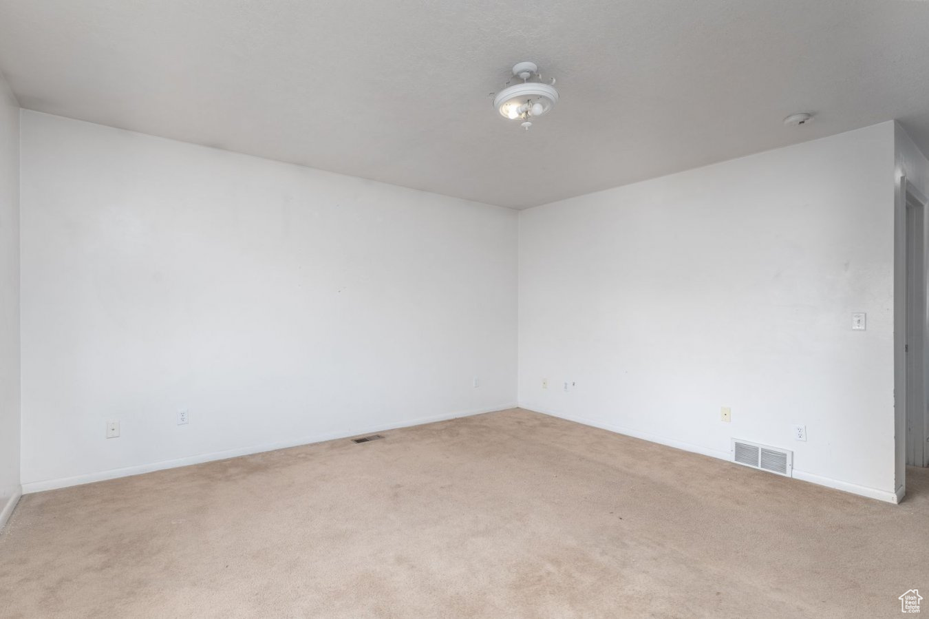 Unfurnished room featuring carpet