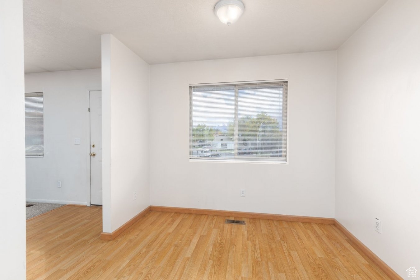 Spare room with light hardwood / wood-style floors