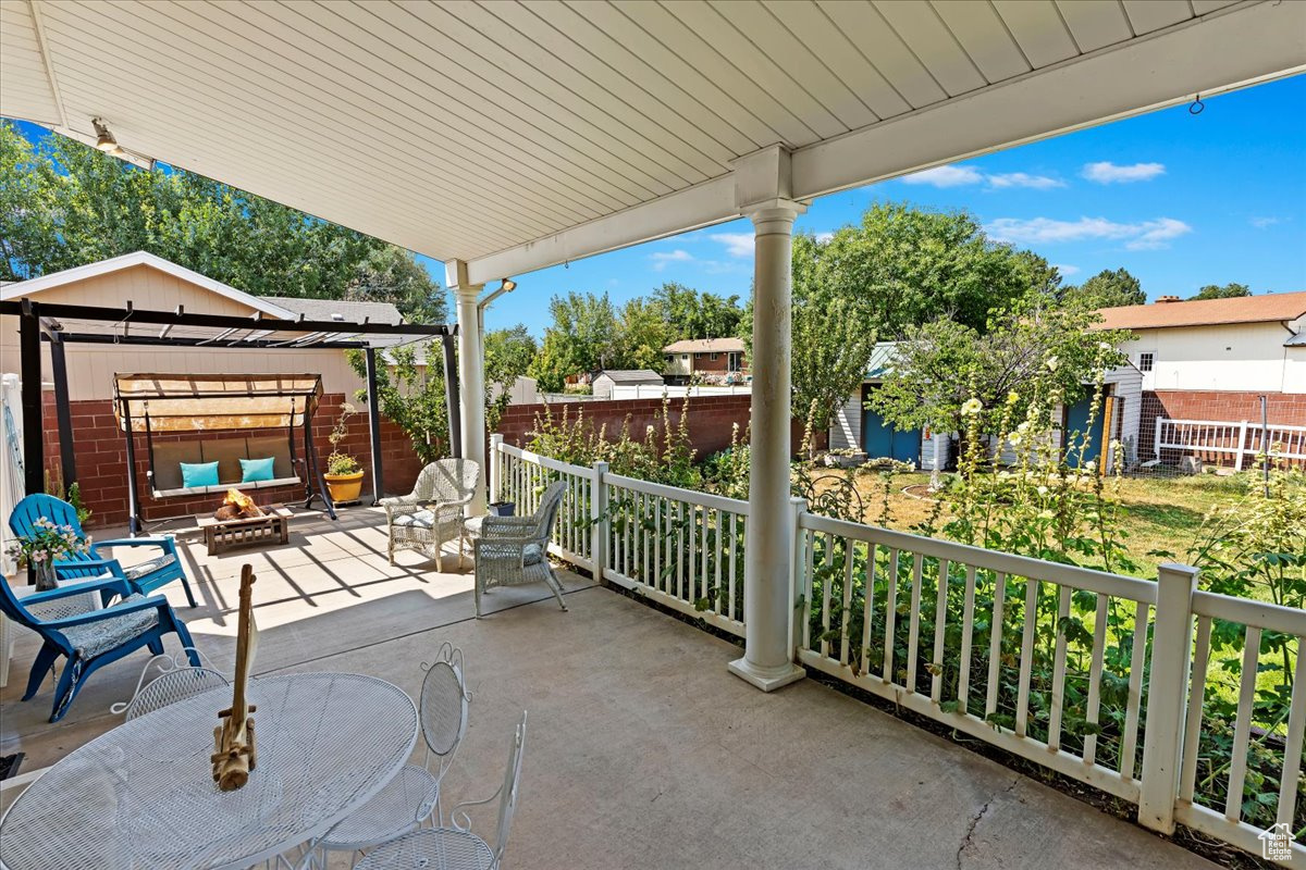 View of patio / terrace with a fire pit