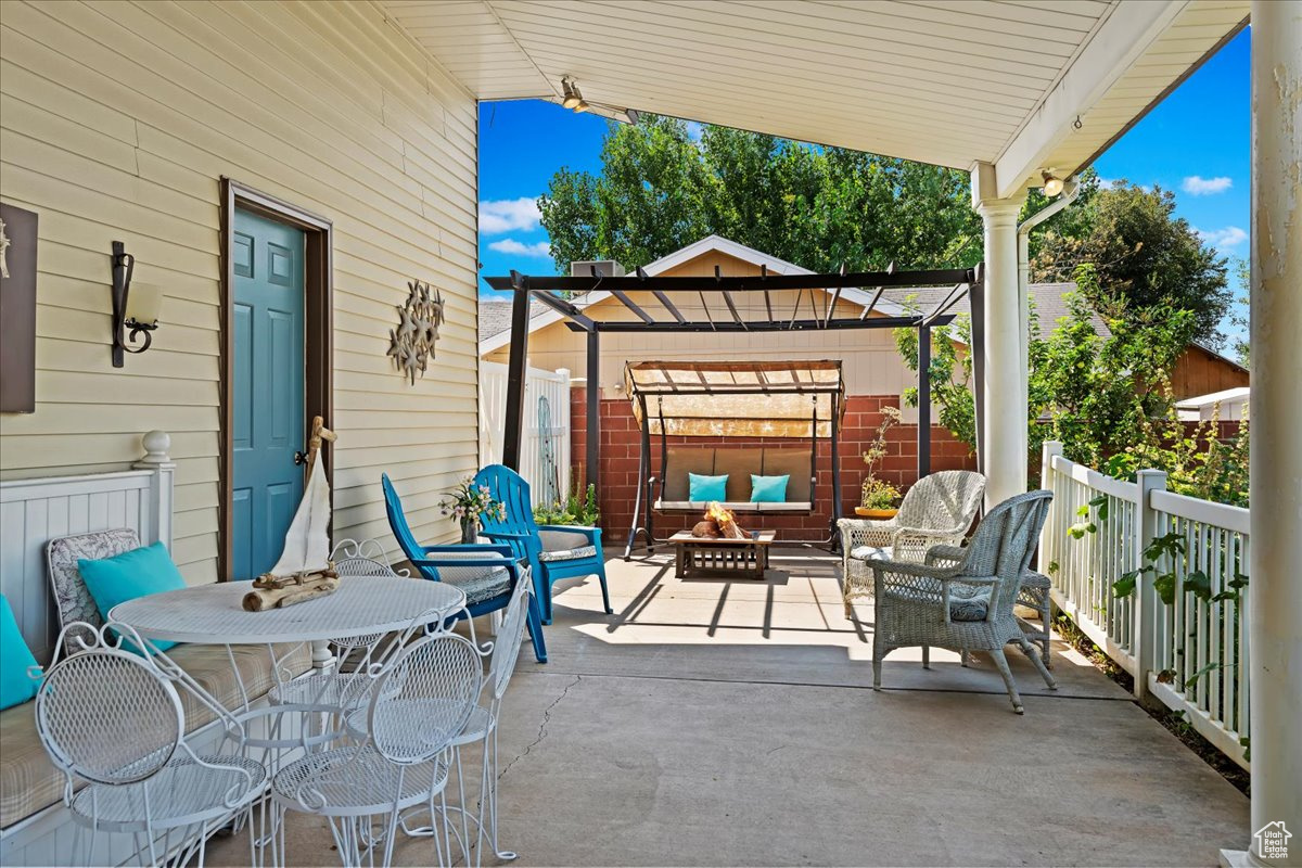 View of patio / terrace featuring a pergola and an outdoor living space with a fireplace