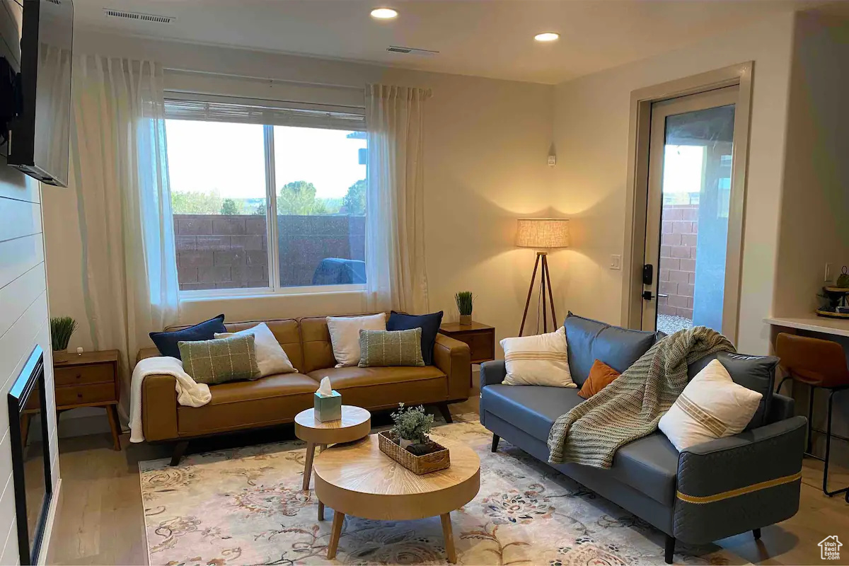 Living room with light hardwood / wood-style floors