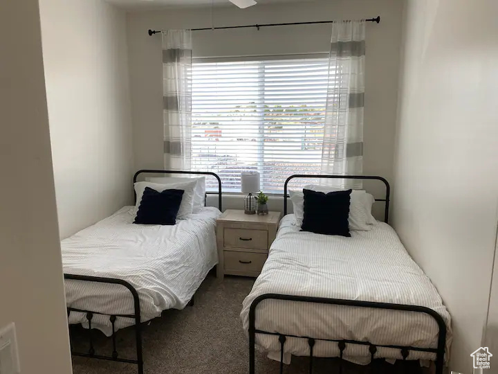 Bedroom featuring carpet floors and ceiling fan