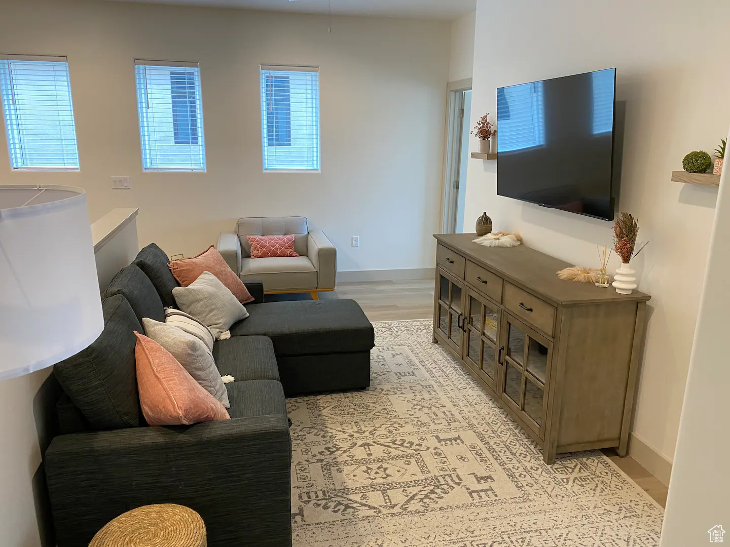 Living room with light hardwood / wood-style flooring