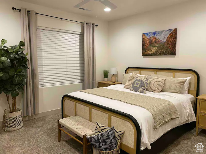 Bedroom featuring carpet and ceiling fan