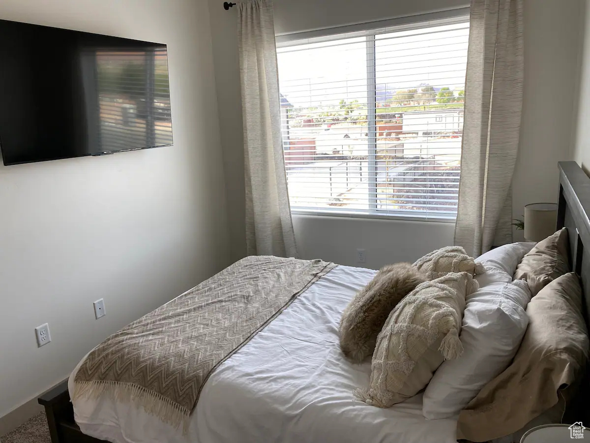 Bedroom featuring multiple windows