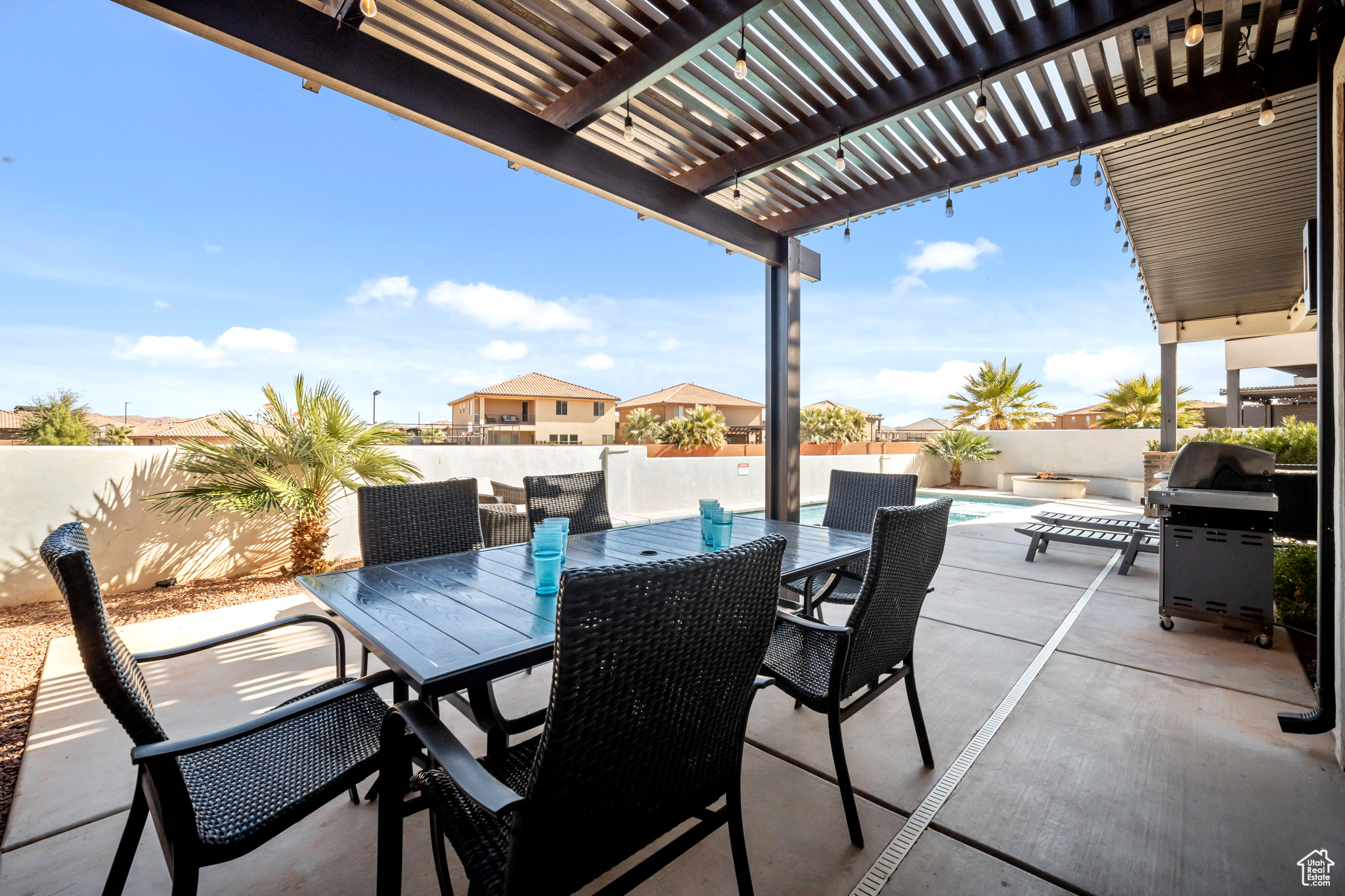 View of patio / terrace with a pergola, a fenced in pool, and grilling area