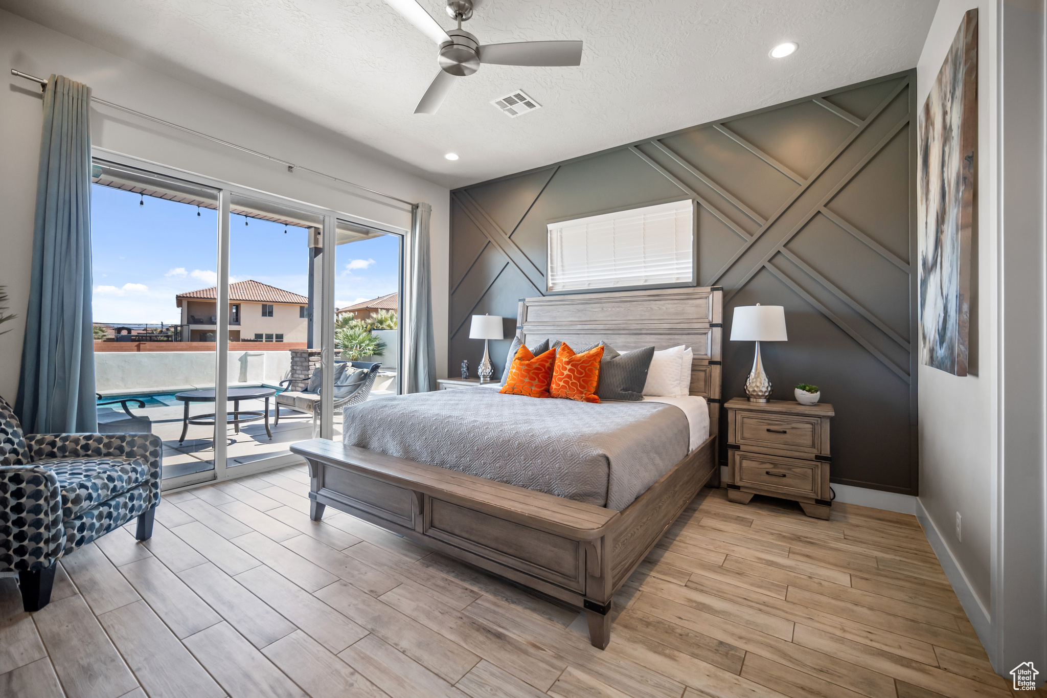 Bedroom with access to outside, light wood-type flooring, and ceiling fan