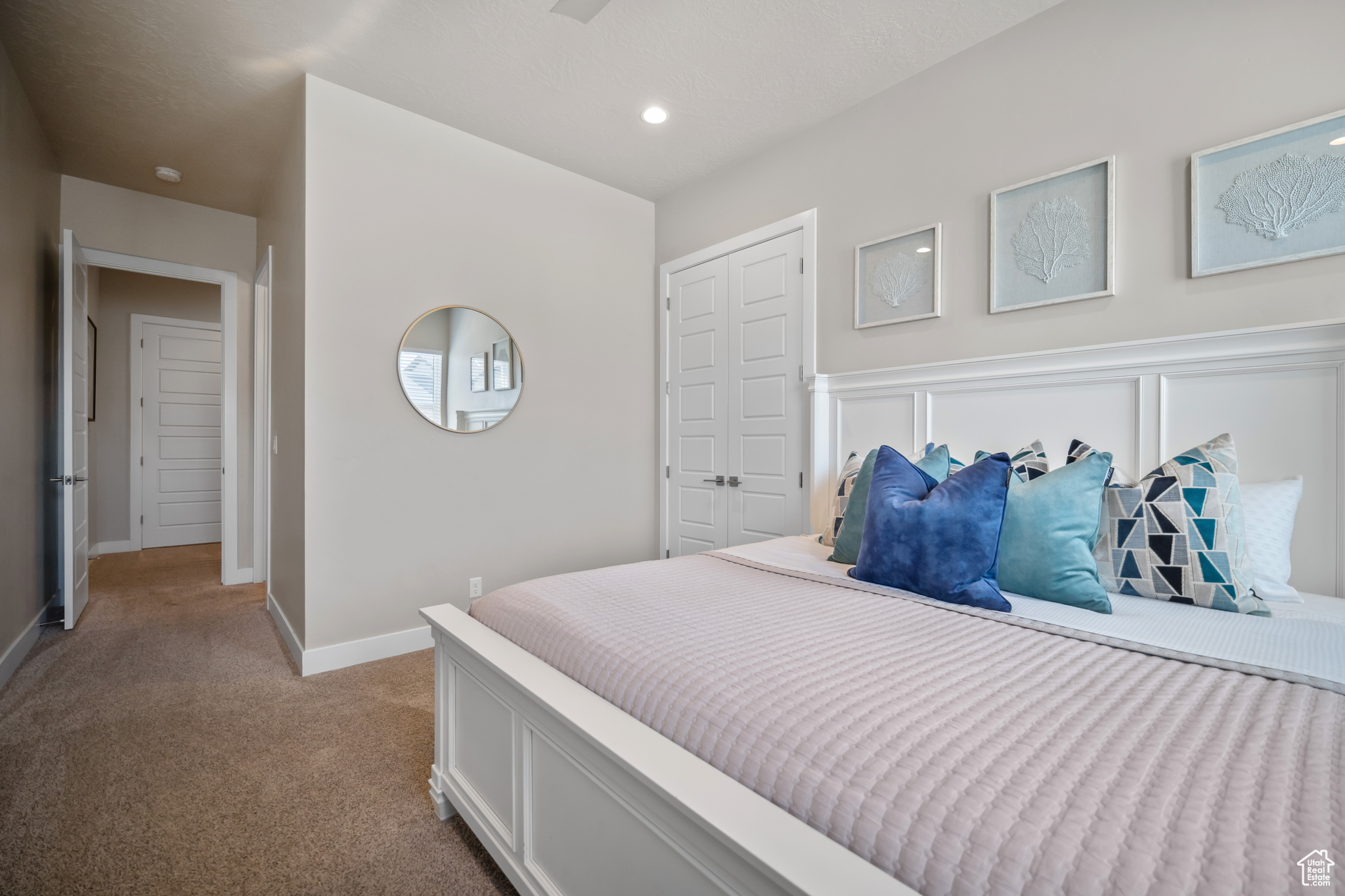 Bedroom with light carpet