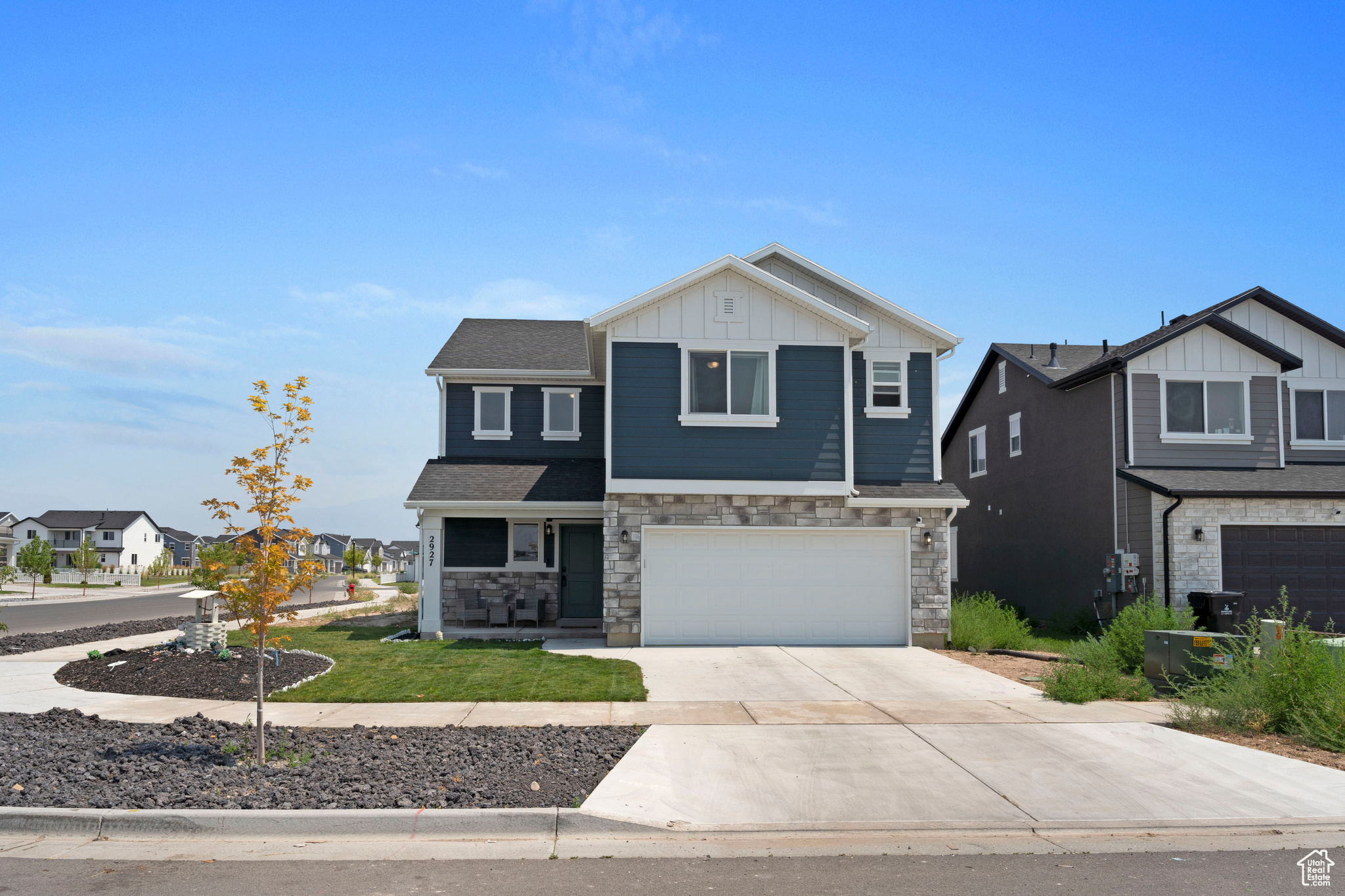 View of front facade featuring a garage