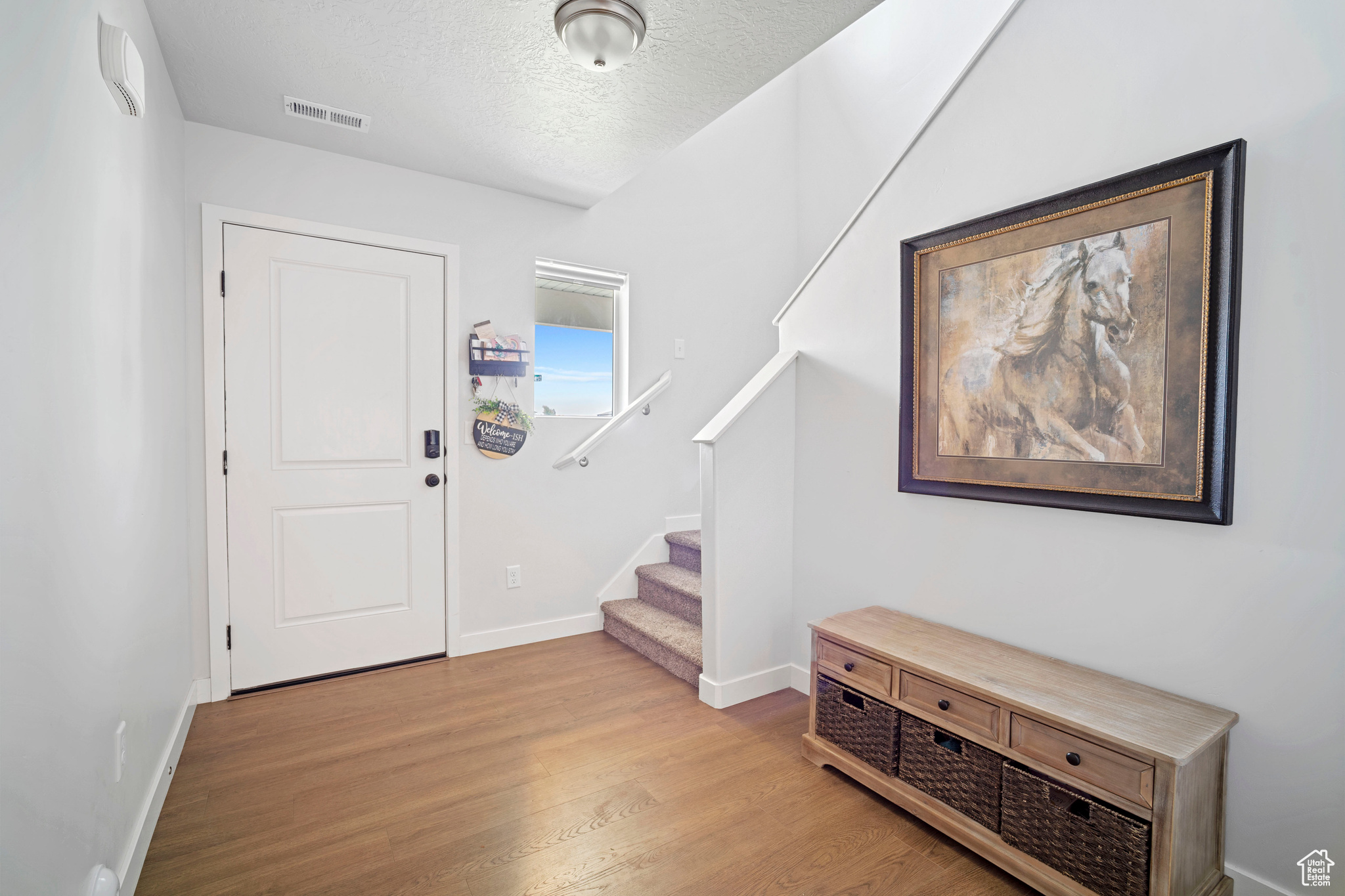 Entryway with light wood-type flooring