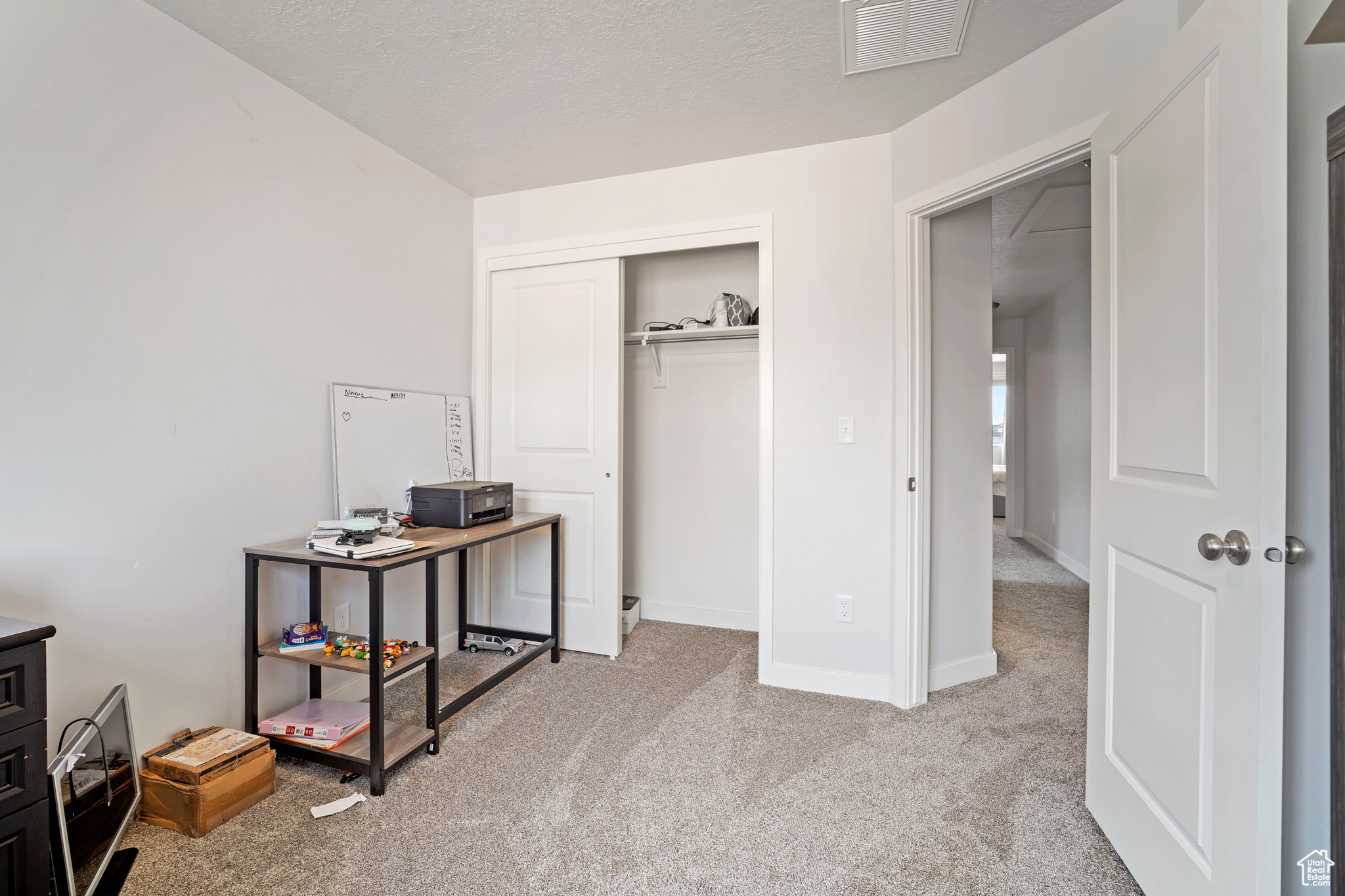 View of carpeted home office