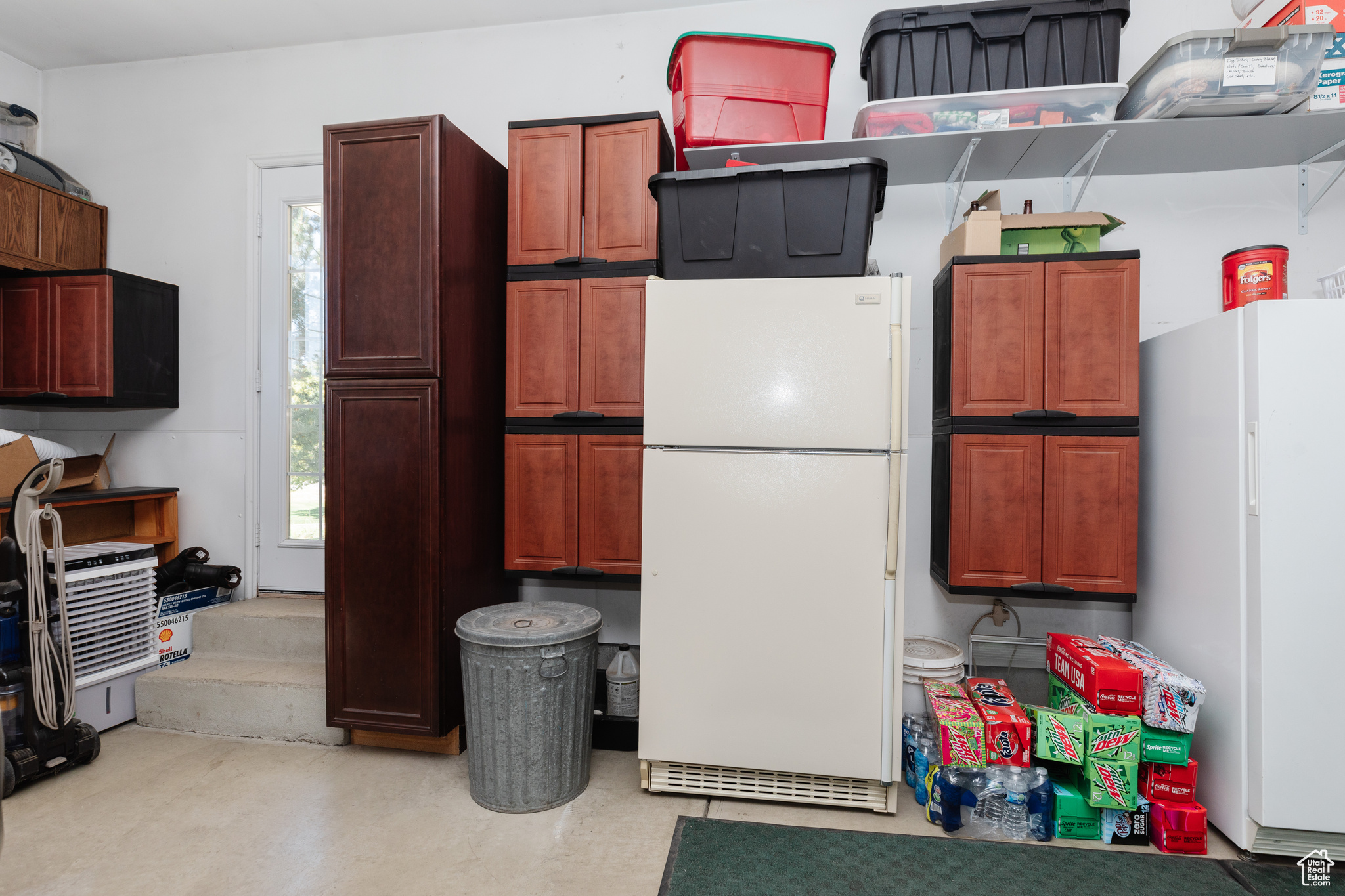 Kitchen featuring white fridge