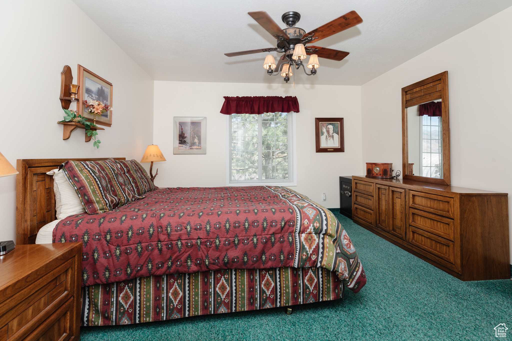 Bedroom featuring carpet and ceiling fan