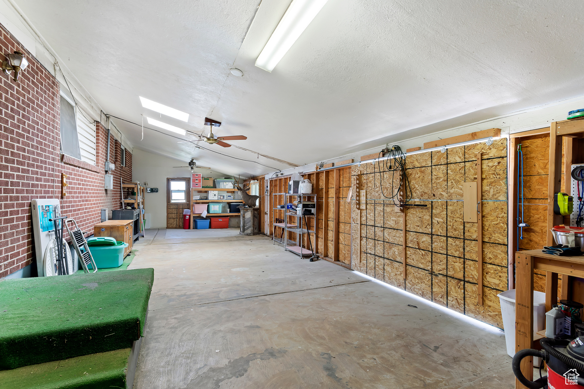 Garage featuring ceiling fan