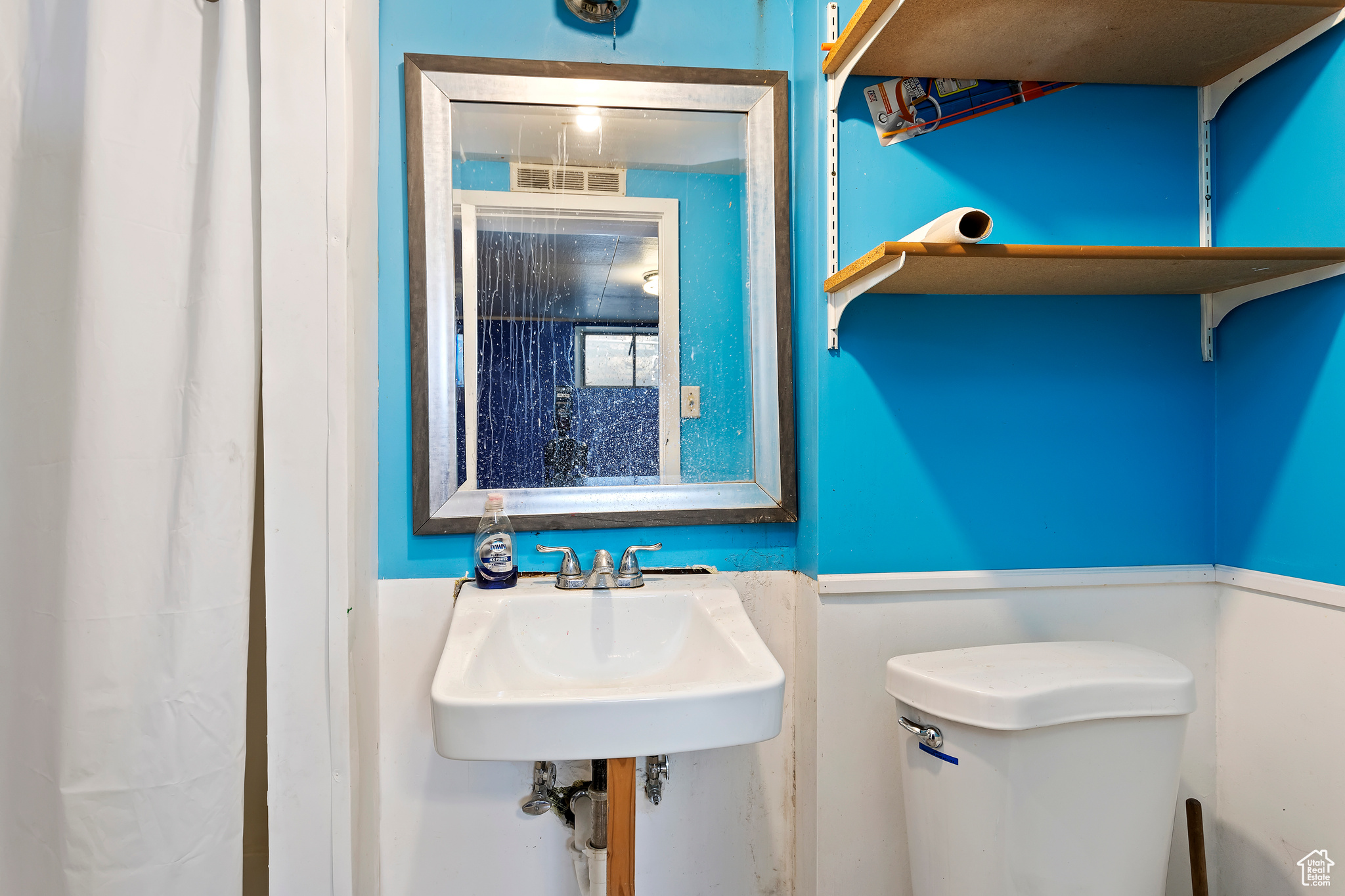 Bathroom featuring sink and toilet