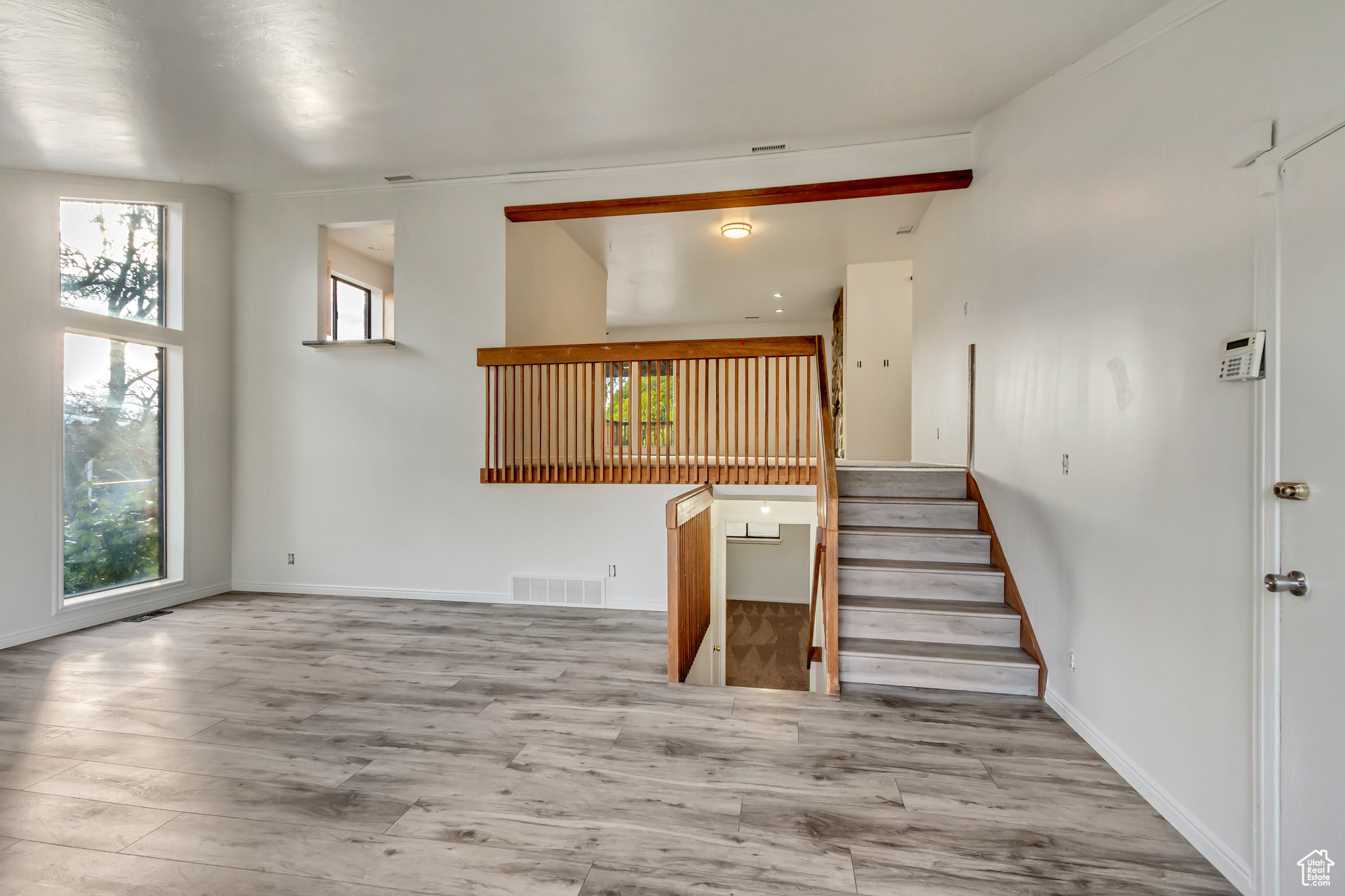 Stairs with hardwood / wood-style flooring