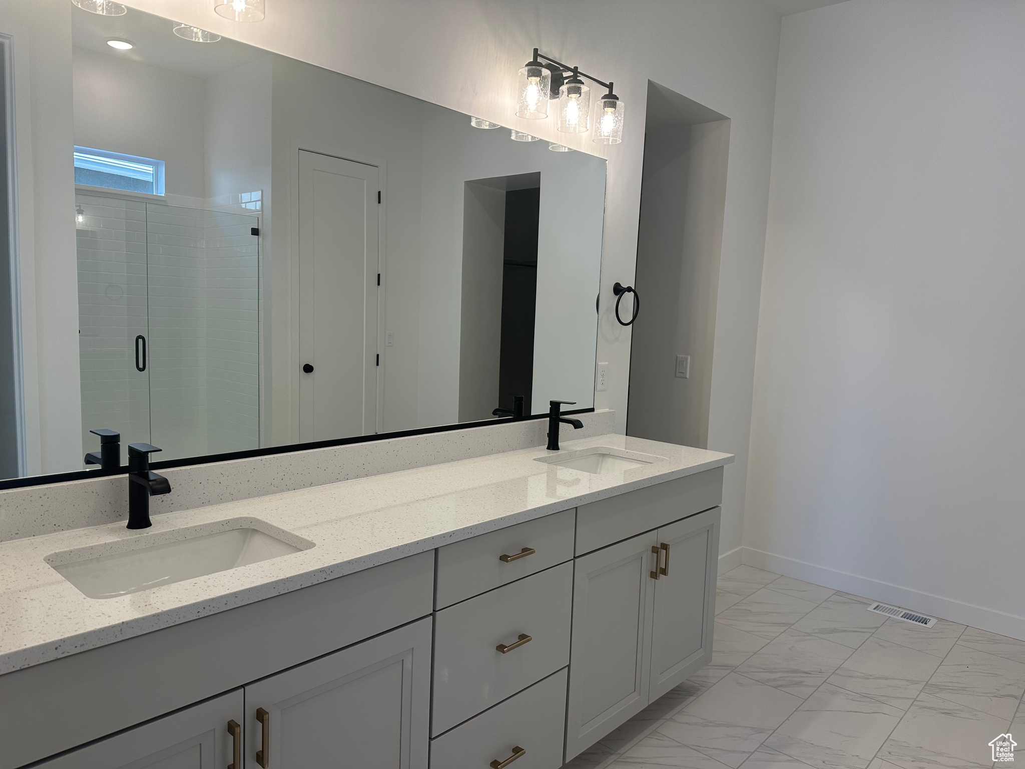 Bathroom with vanity and an enclosed shower