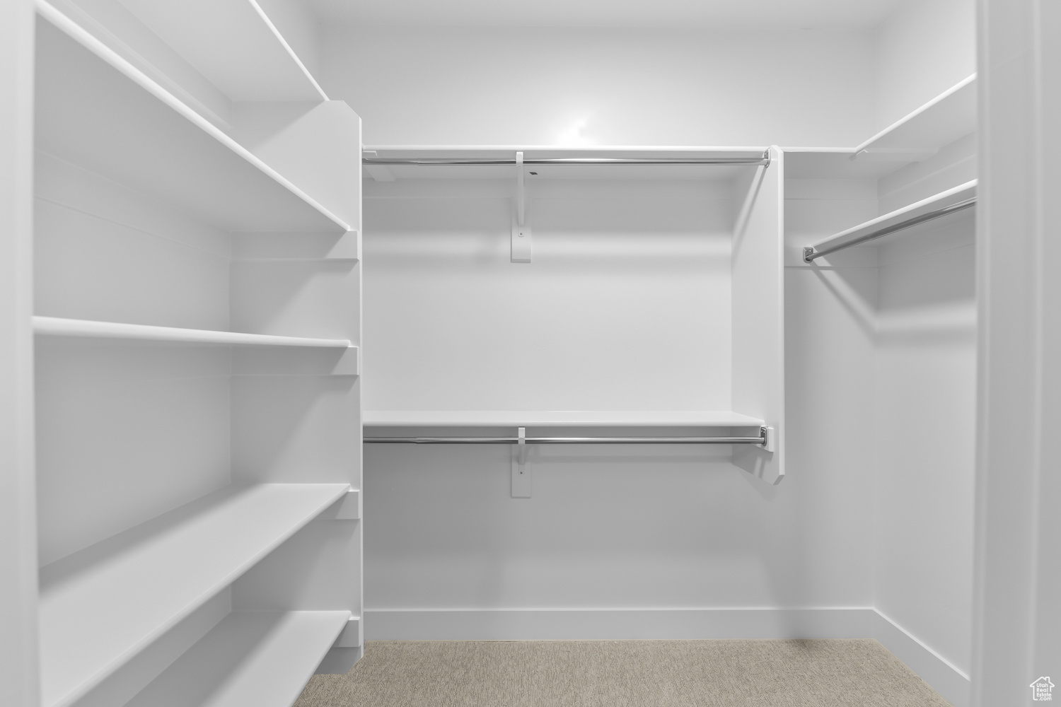 Spacious closet with carpet flooring