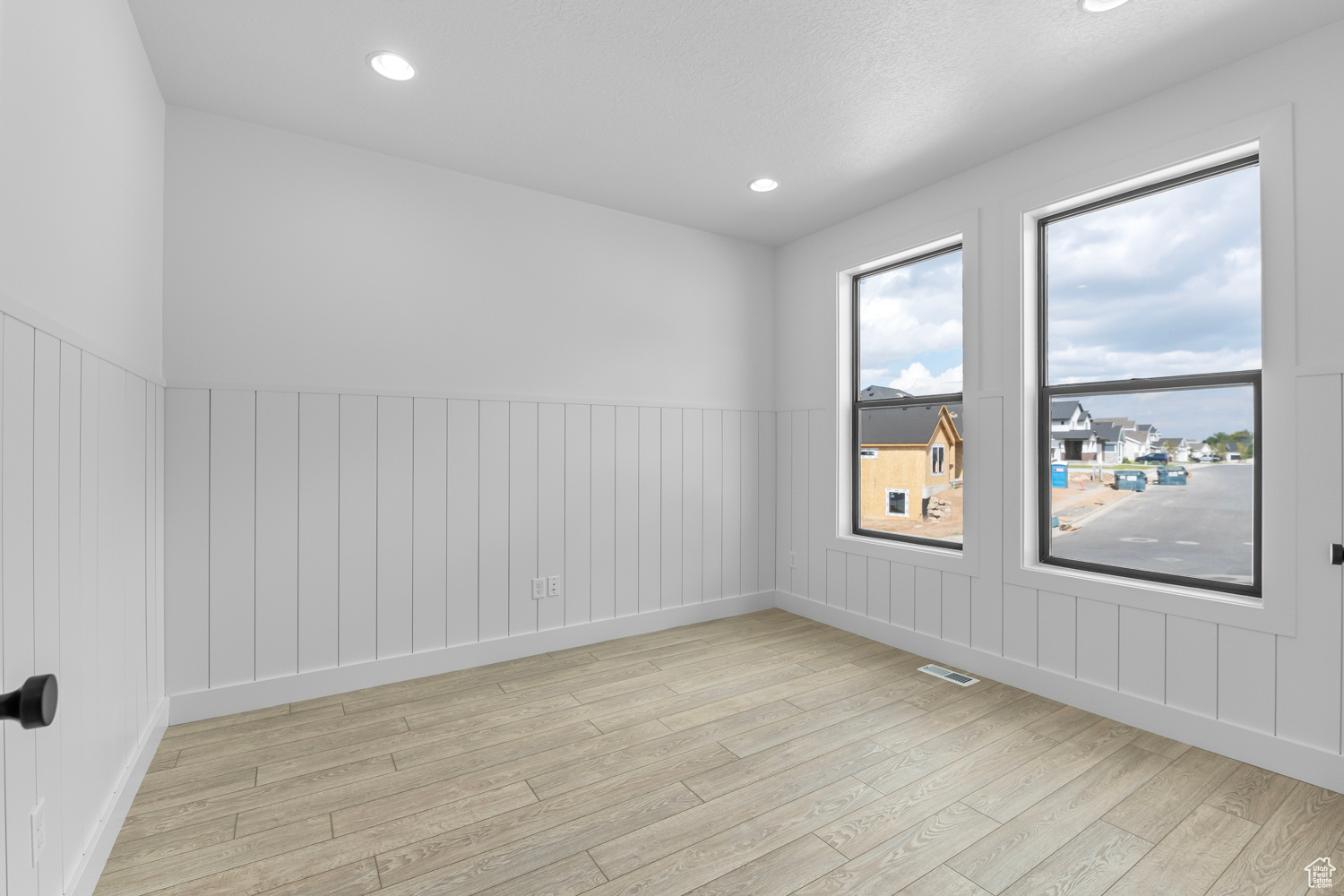 Spare room featuring light hardwood / wood-style floors