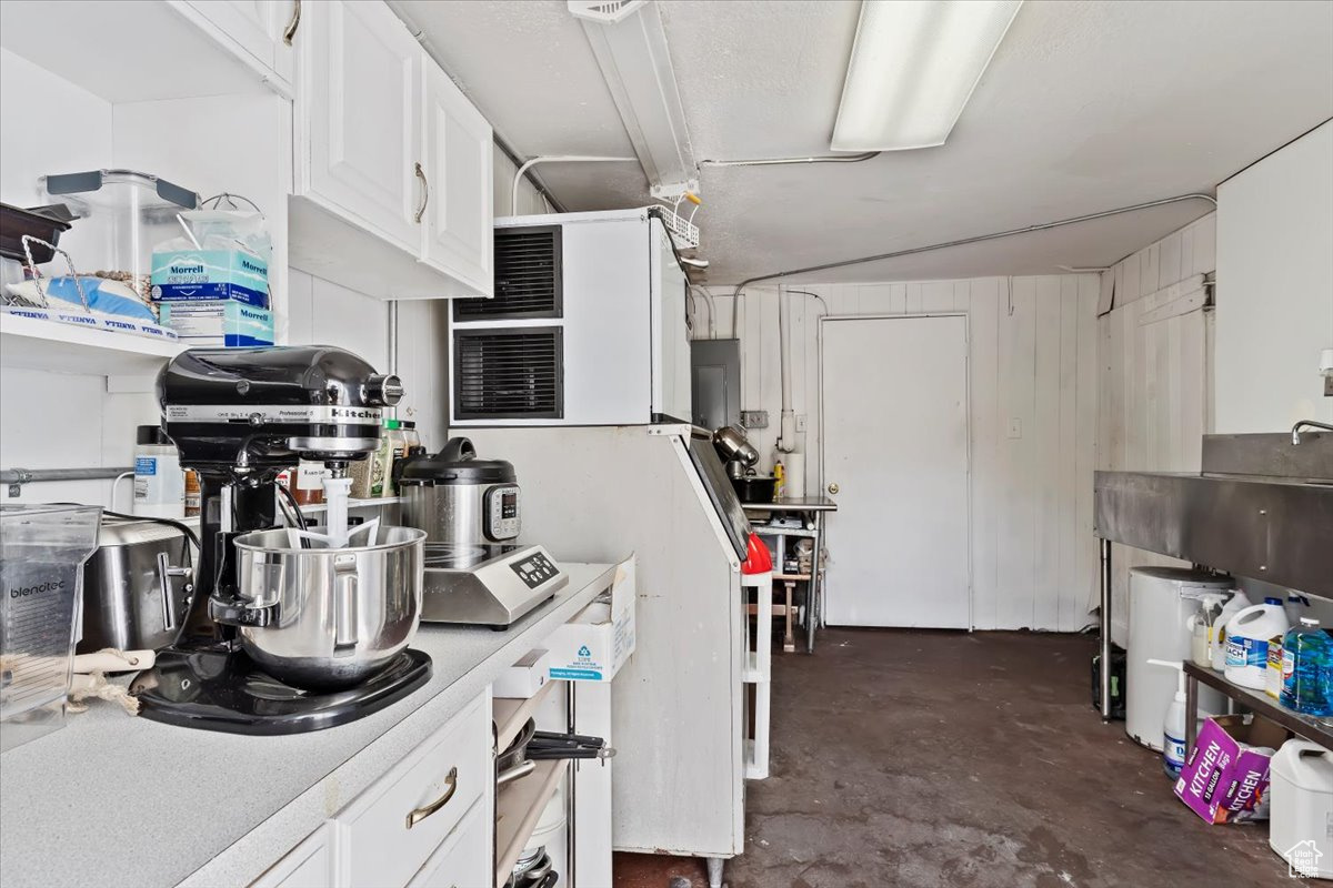 Kitchen featuring white cabinets