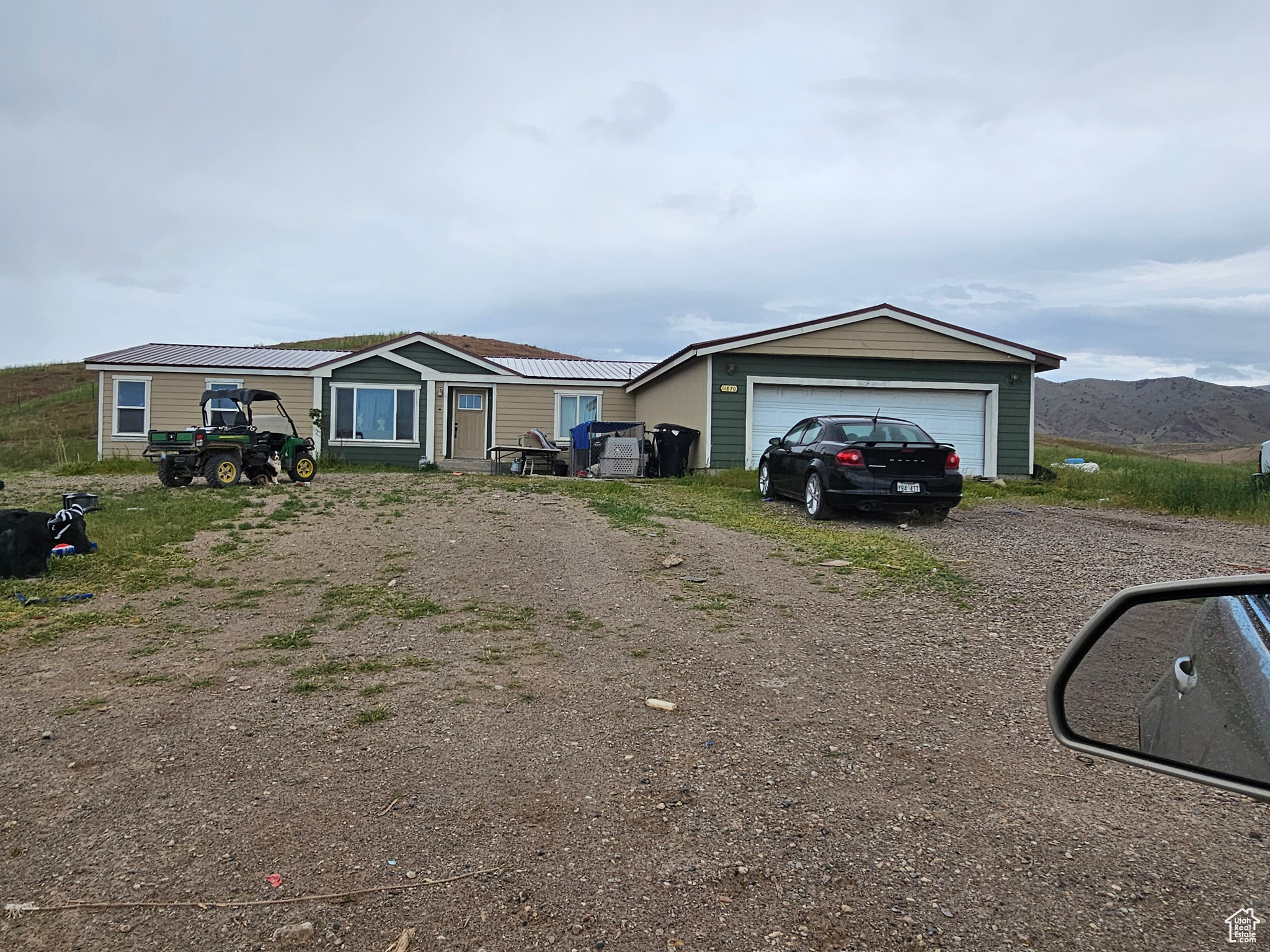 View of front of home #2 featuring a  garage and an outdoor structure.