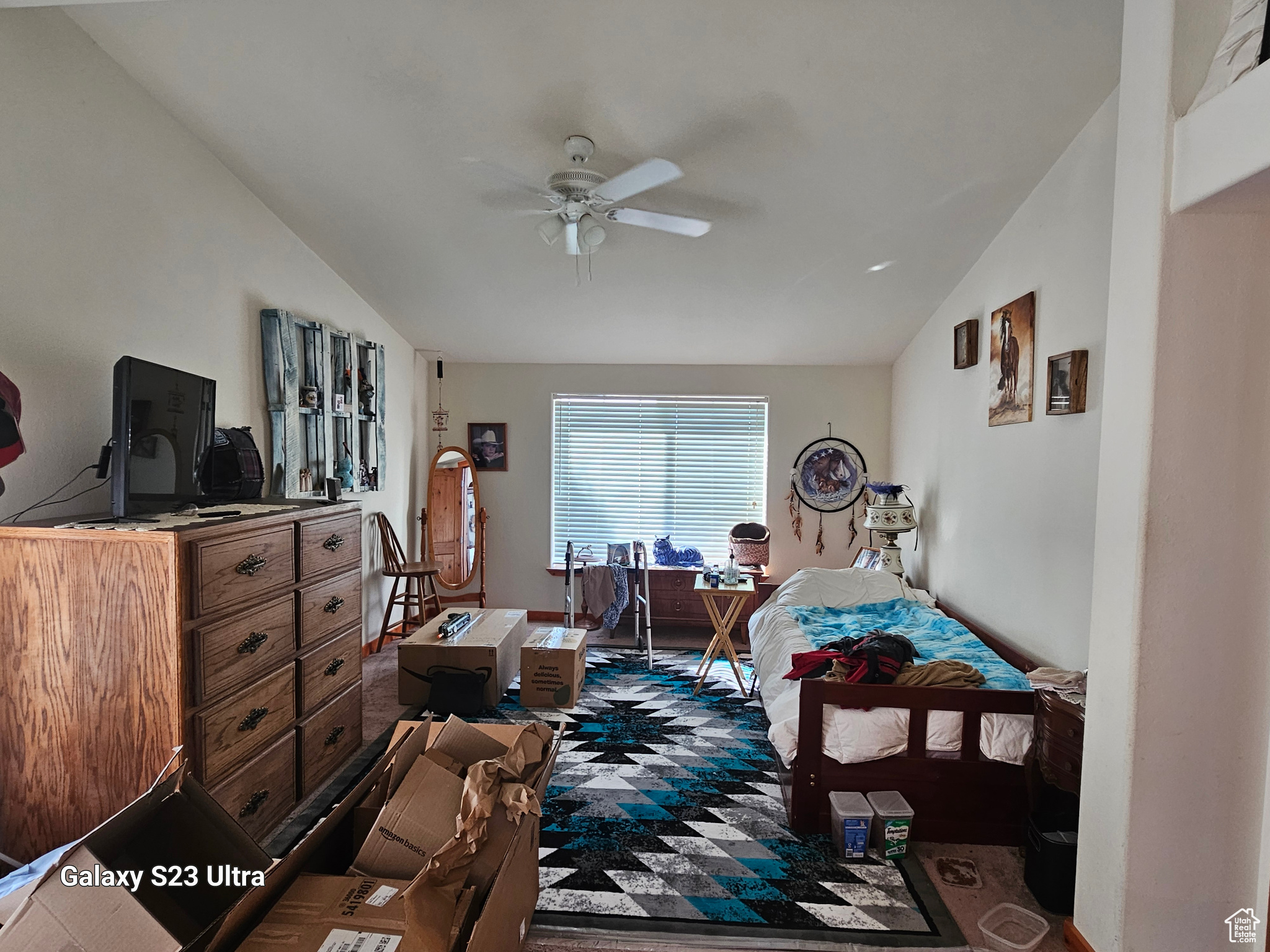 Master Bedroom with lofted ceiling, dark colored carpet, and ceiling fan