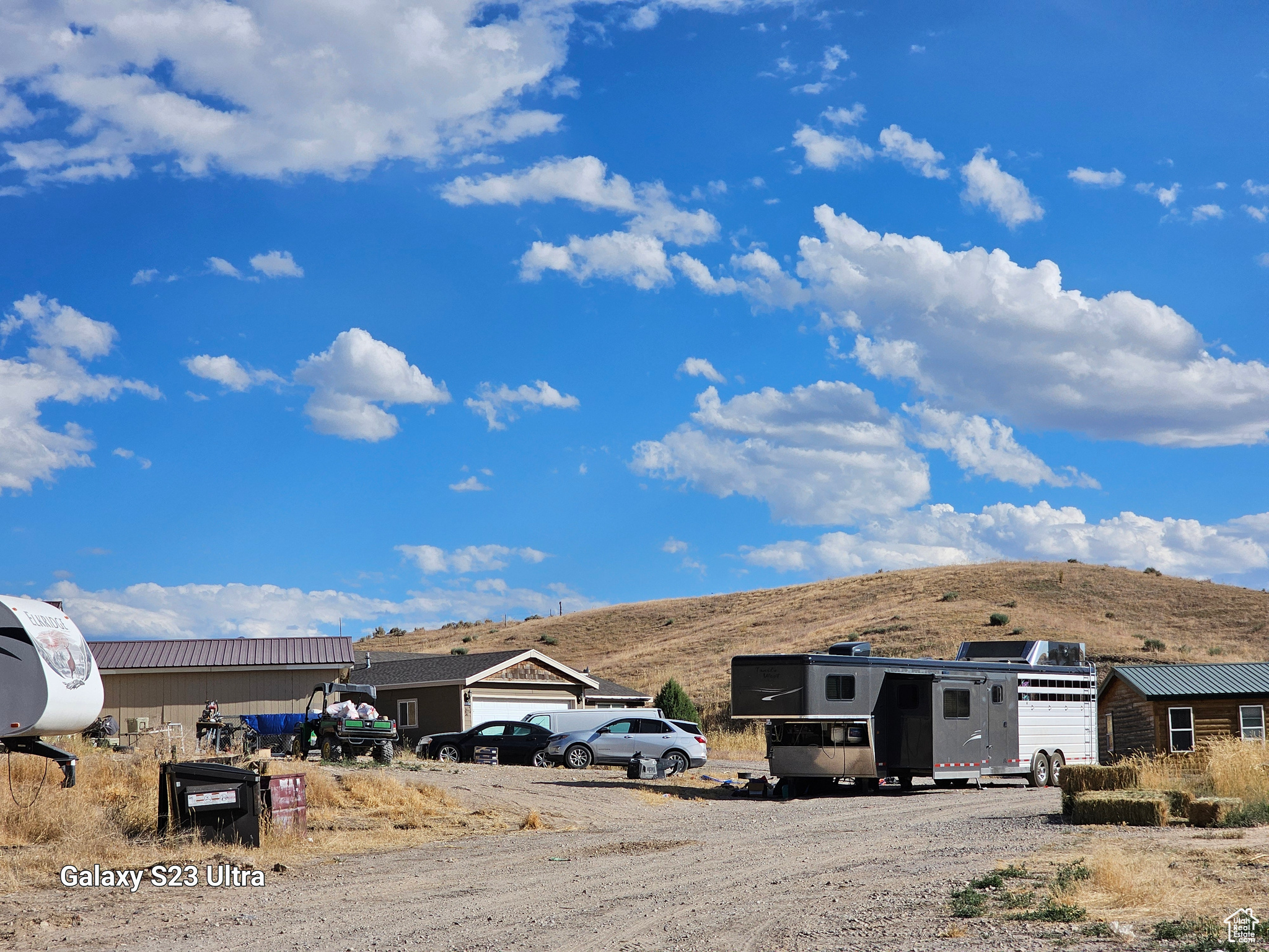 Exterior space featuring a mountain view and an outdoor structure.