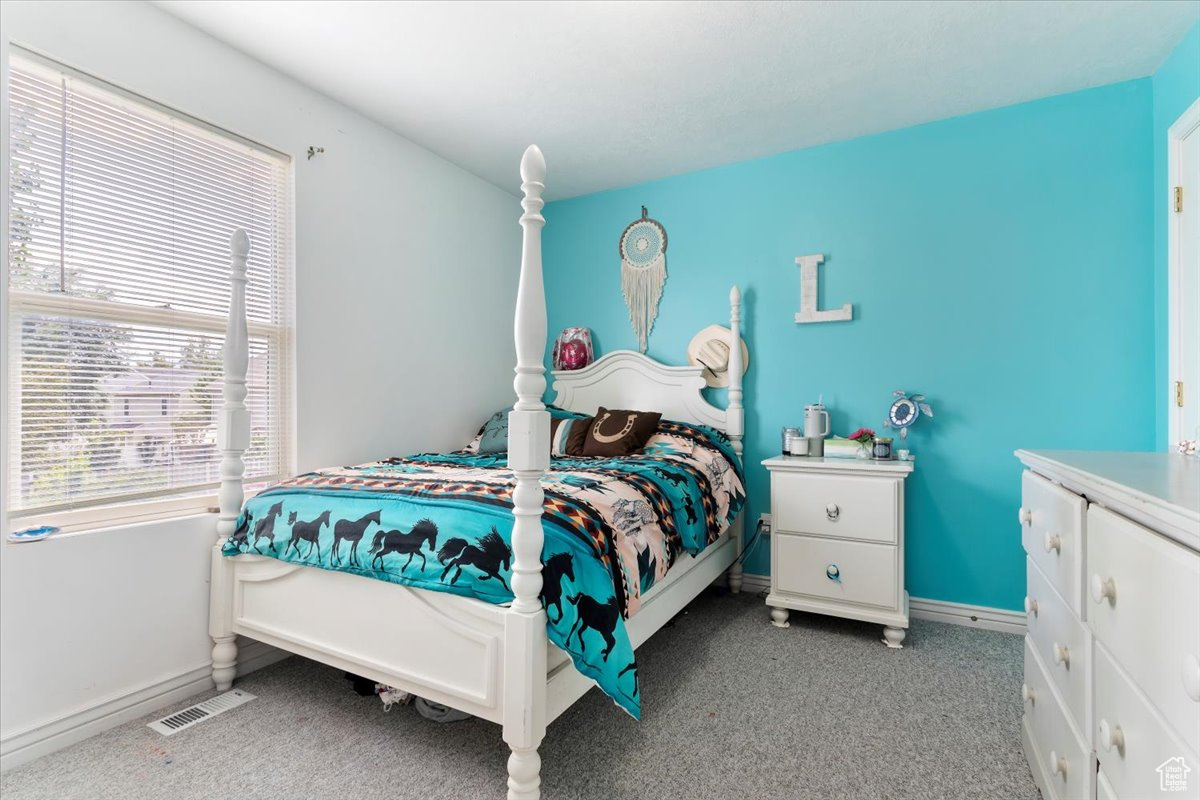 View of carpeted bedroom